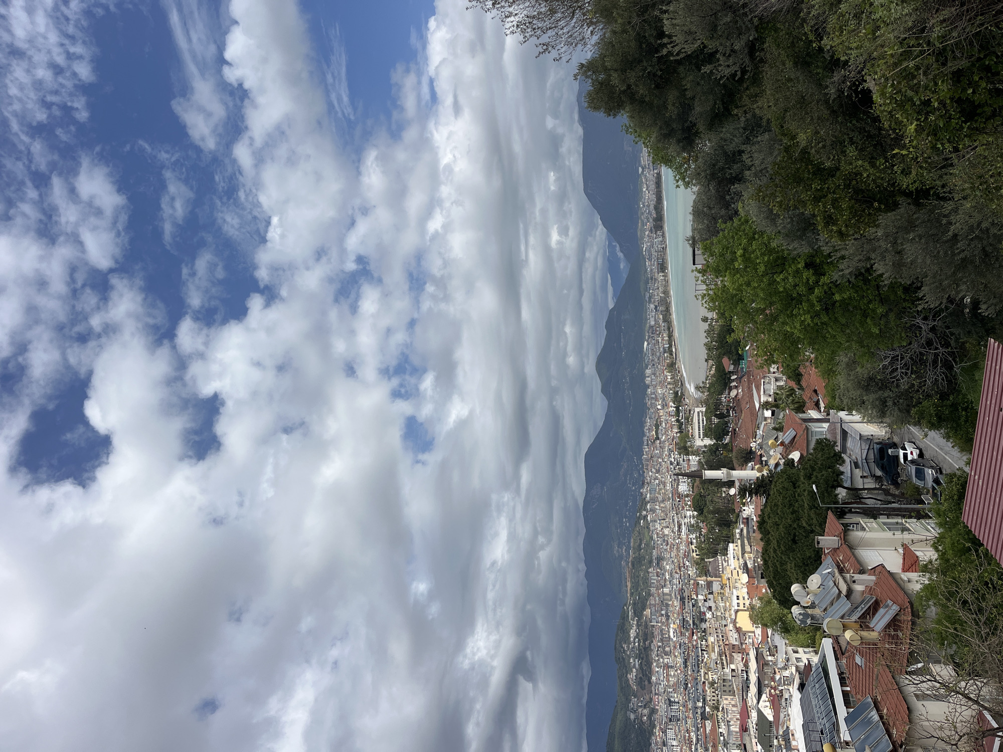 Tourist documents morning views of Alanya cityscape and buildings