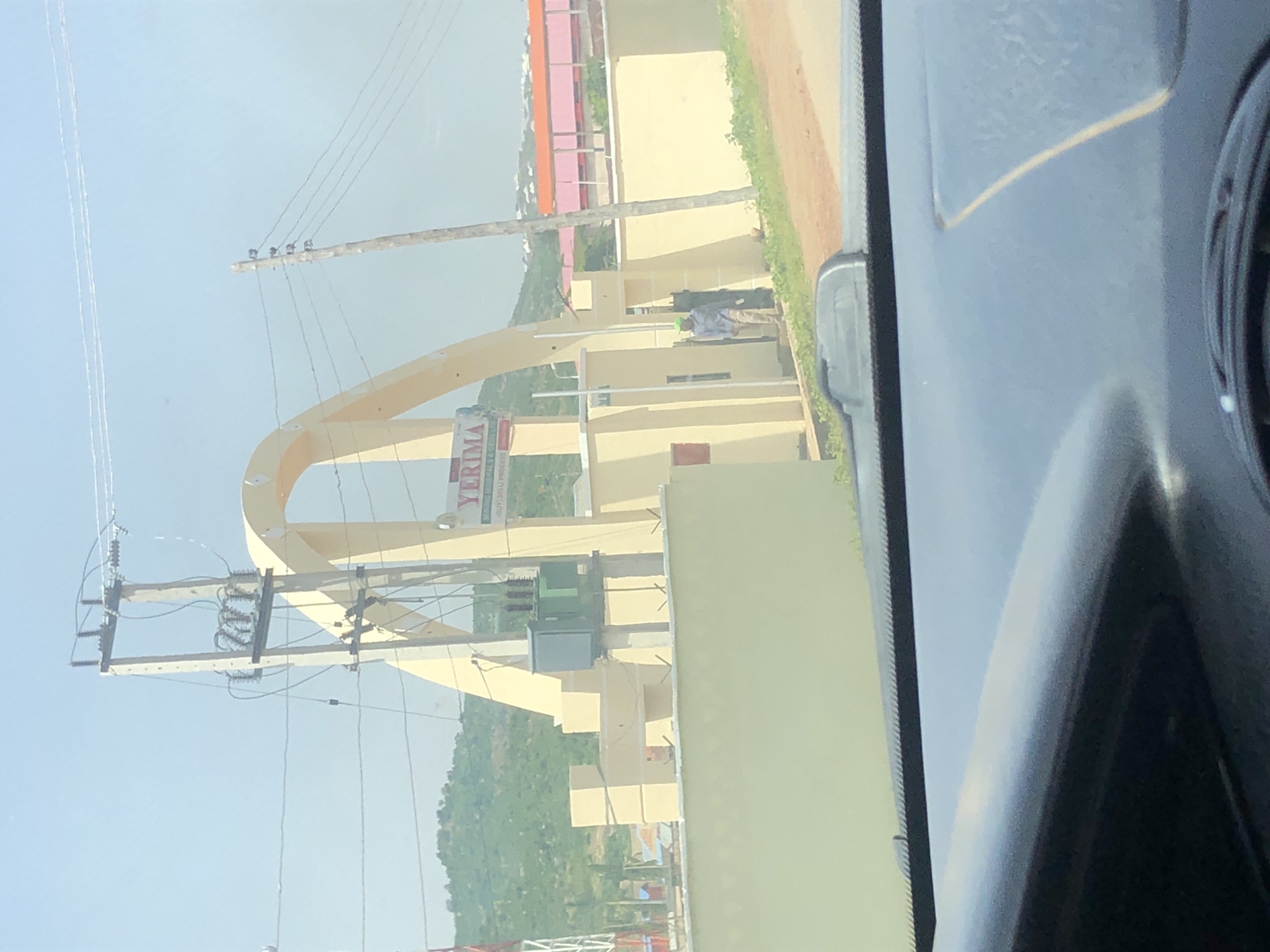 Street view and yellow archway in Jos, Nigeria
