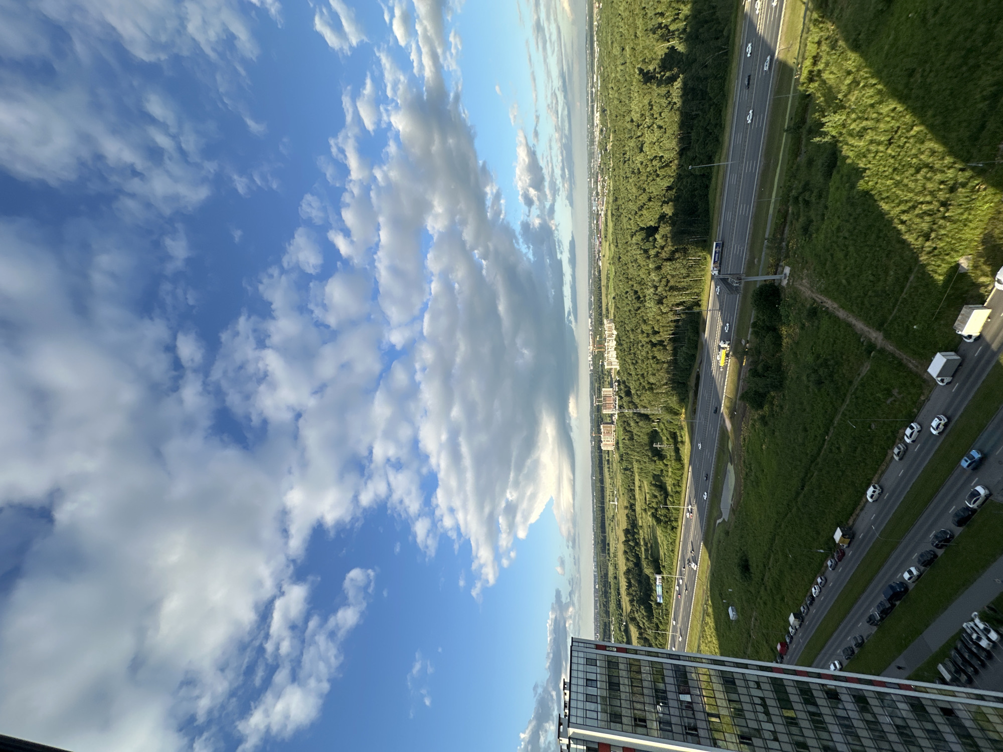 Rooftop views across Kudrovo's modern skyline and highway corridor