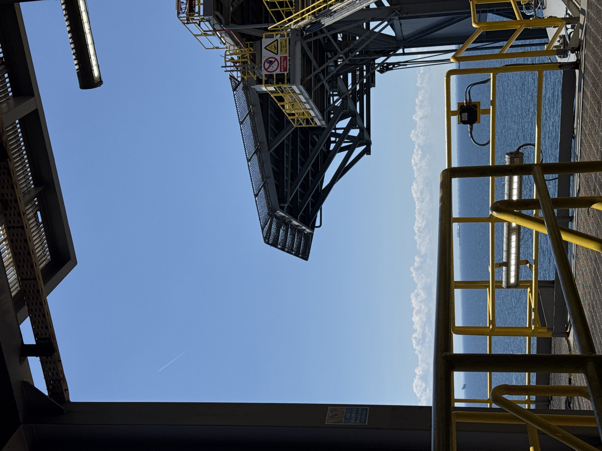 Offshore platform scenes off Italy, plus a stray hashtag graphic
