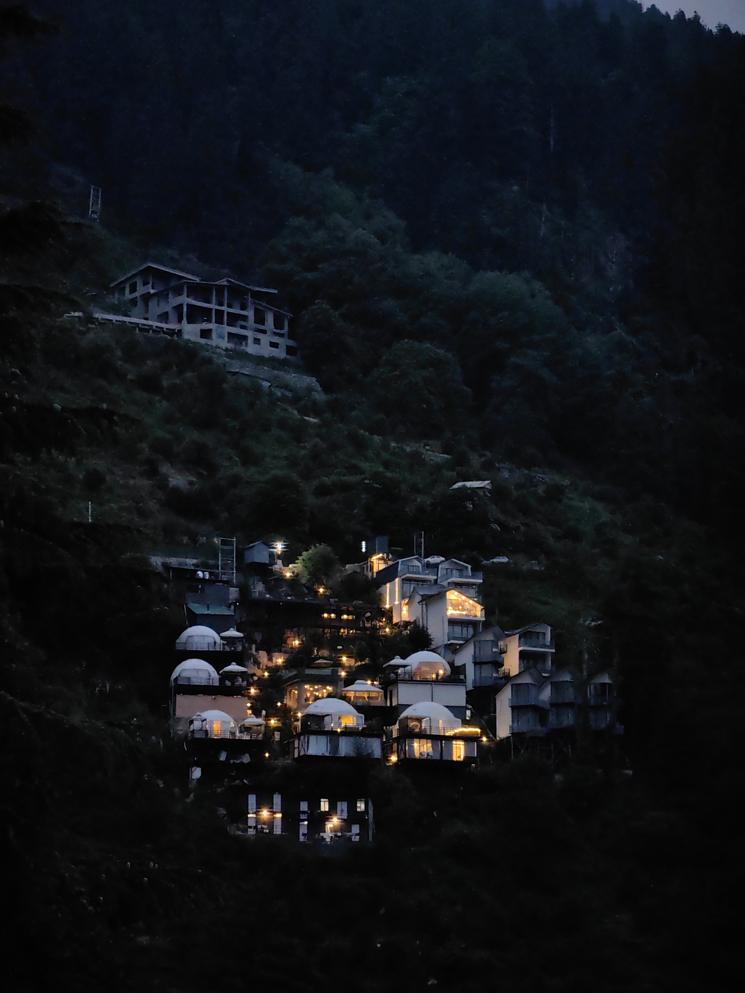 Hillside construction and forest views in Prini, Himachal Pradesh
