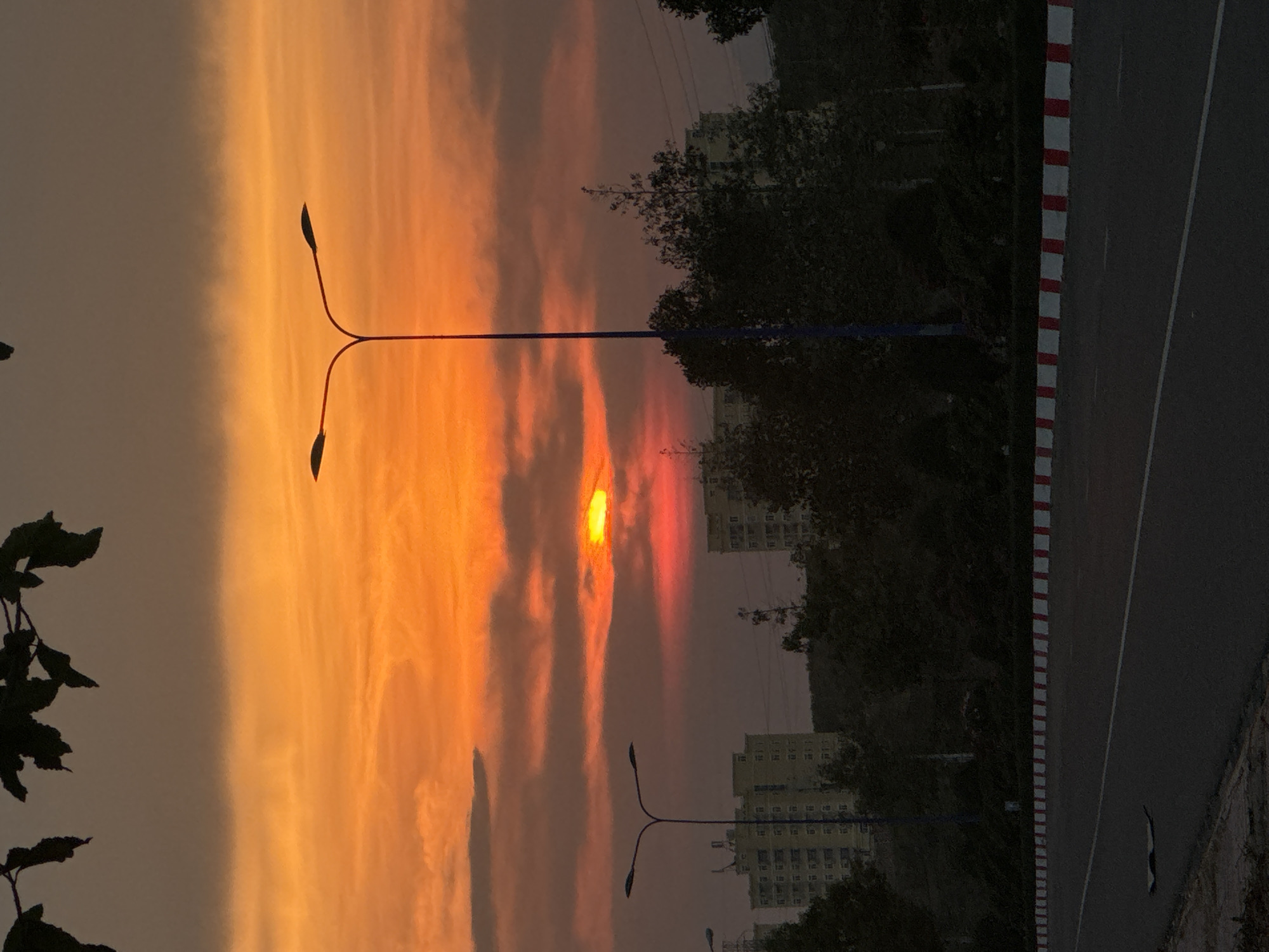 Orange sunset captured across Mui Ne Vietnam streets
