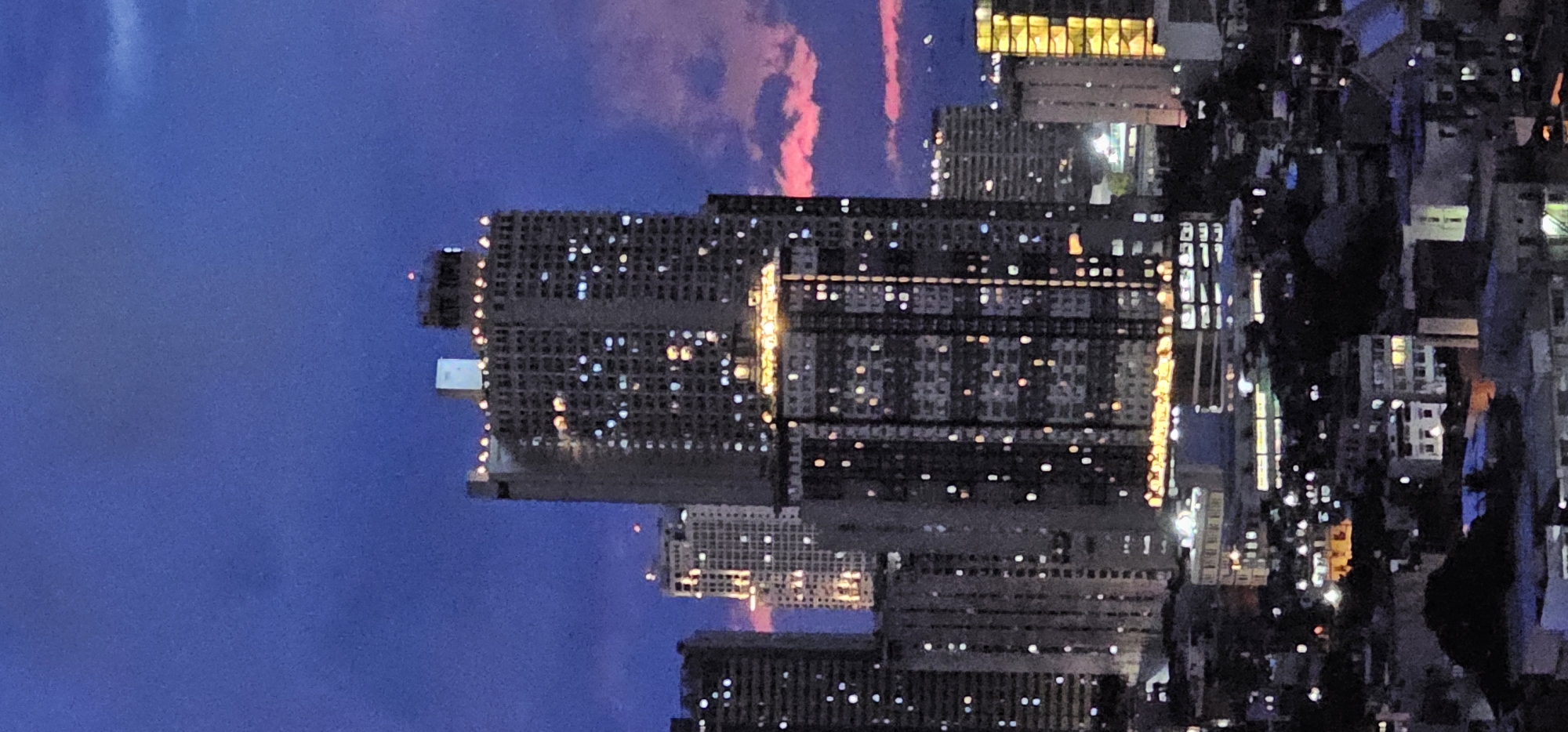 Makati skyline and streets at dusk, seen from above