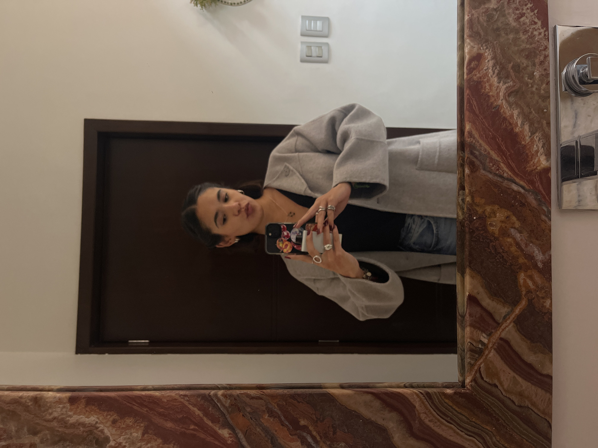 Woman takes mirror selfies in San Bernardino Tlaxcalancingo