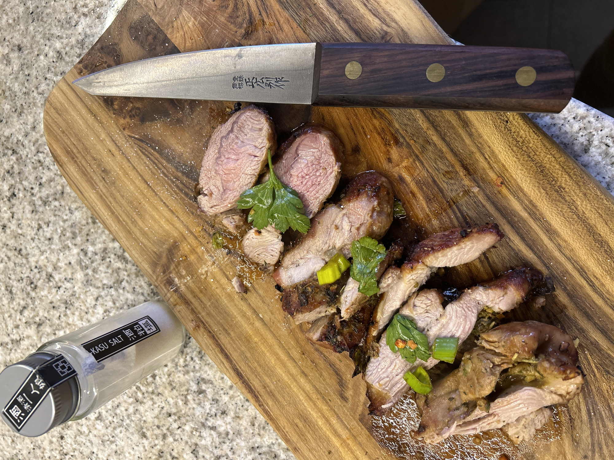 Home cook prepares seasoned meat in Riga kitchen
