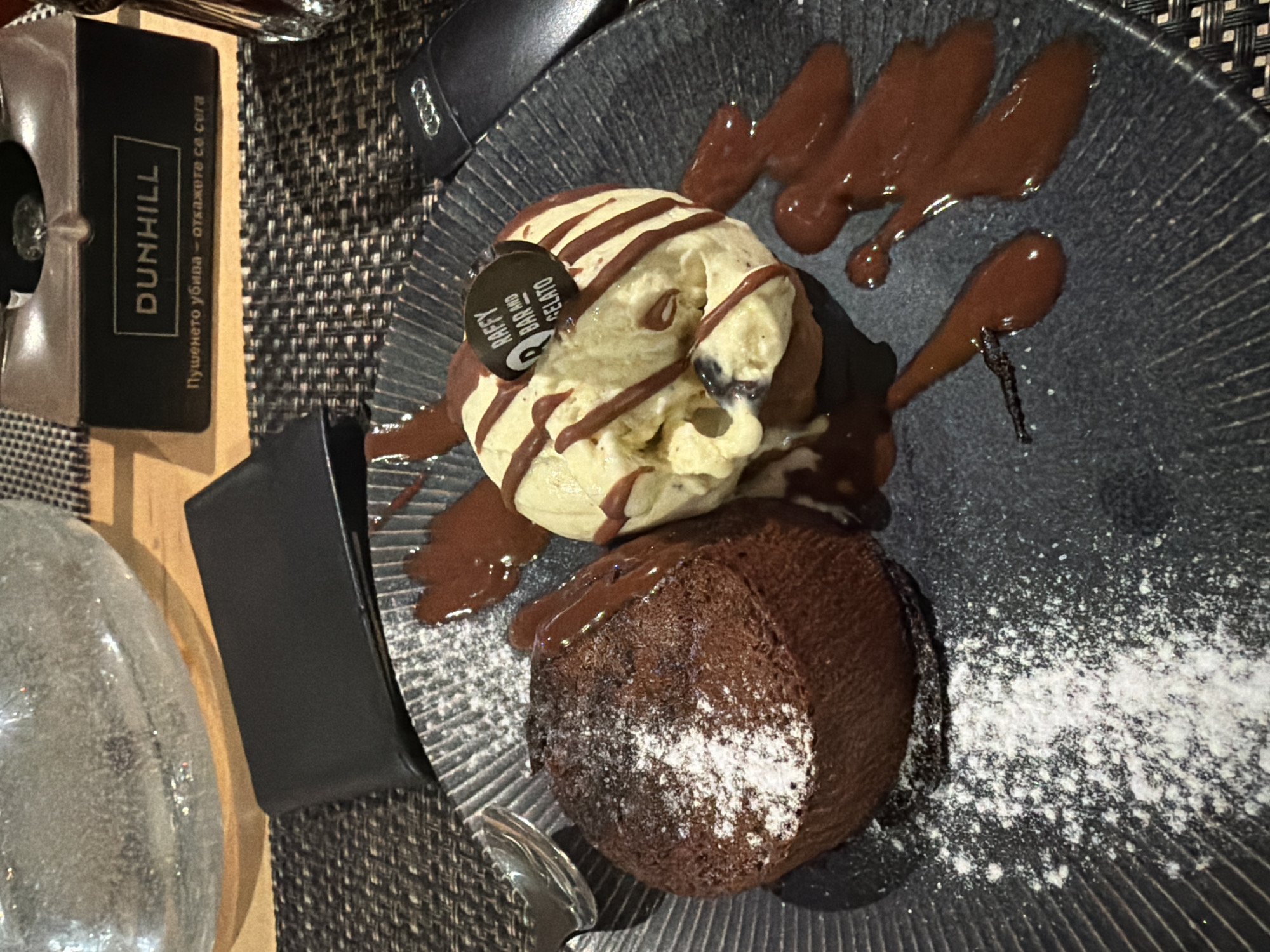 Two men dine together at Plovdiv restaurant with dessert