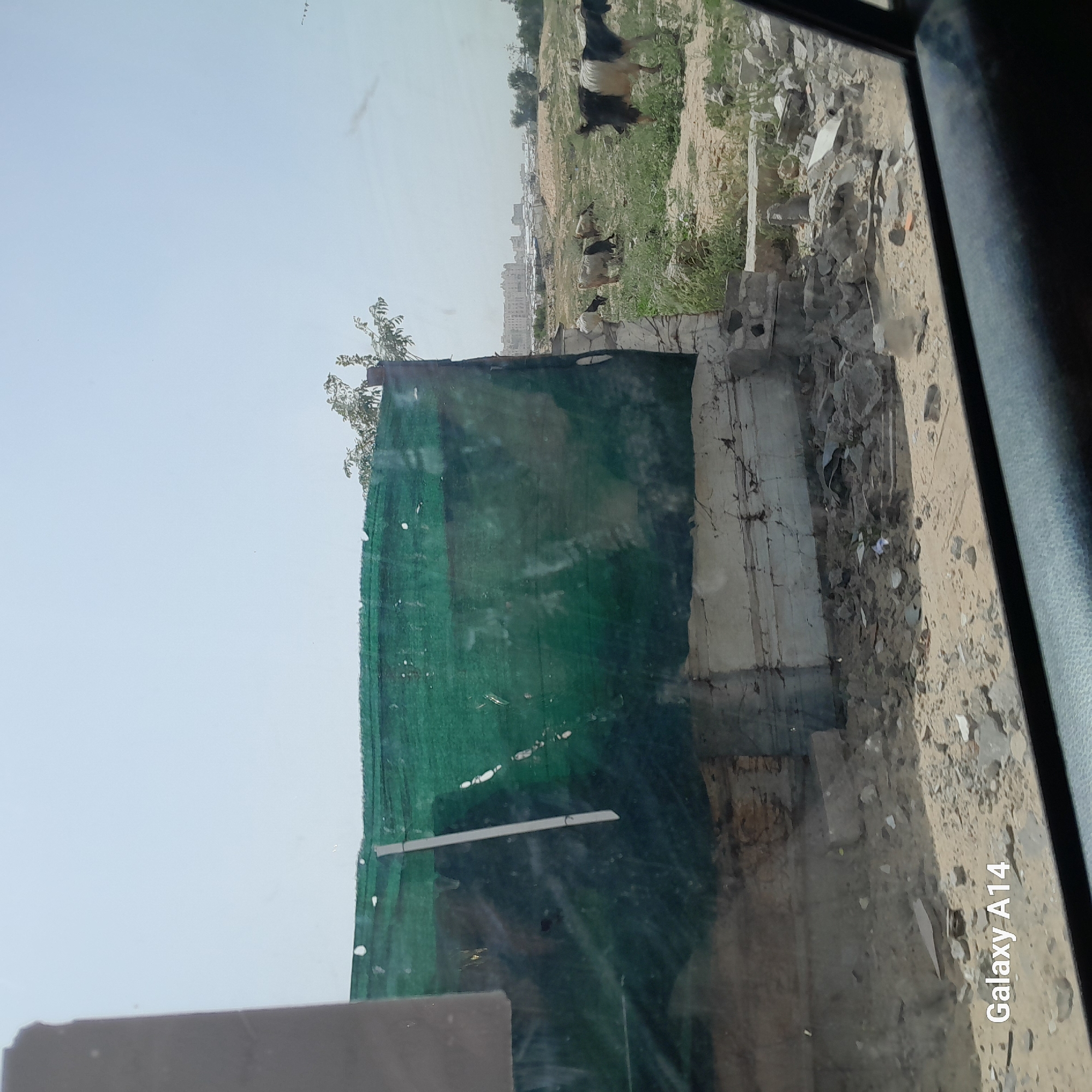 Vehicle passenger documents damaged structures in al-Qarara, Palestinian Territory