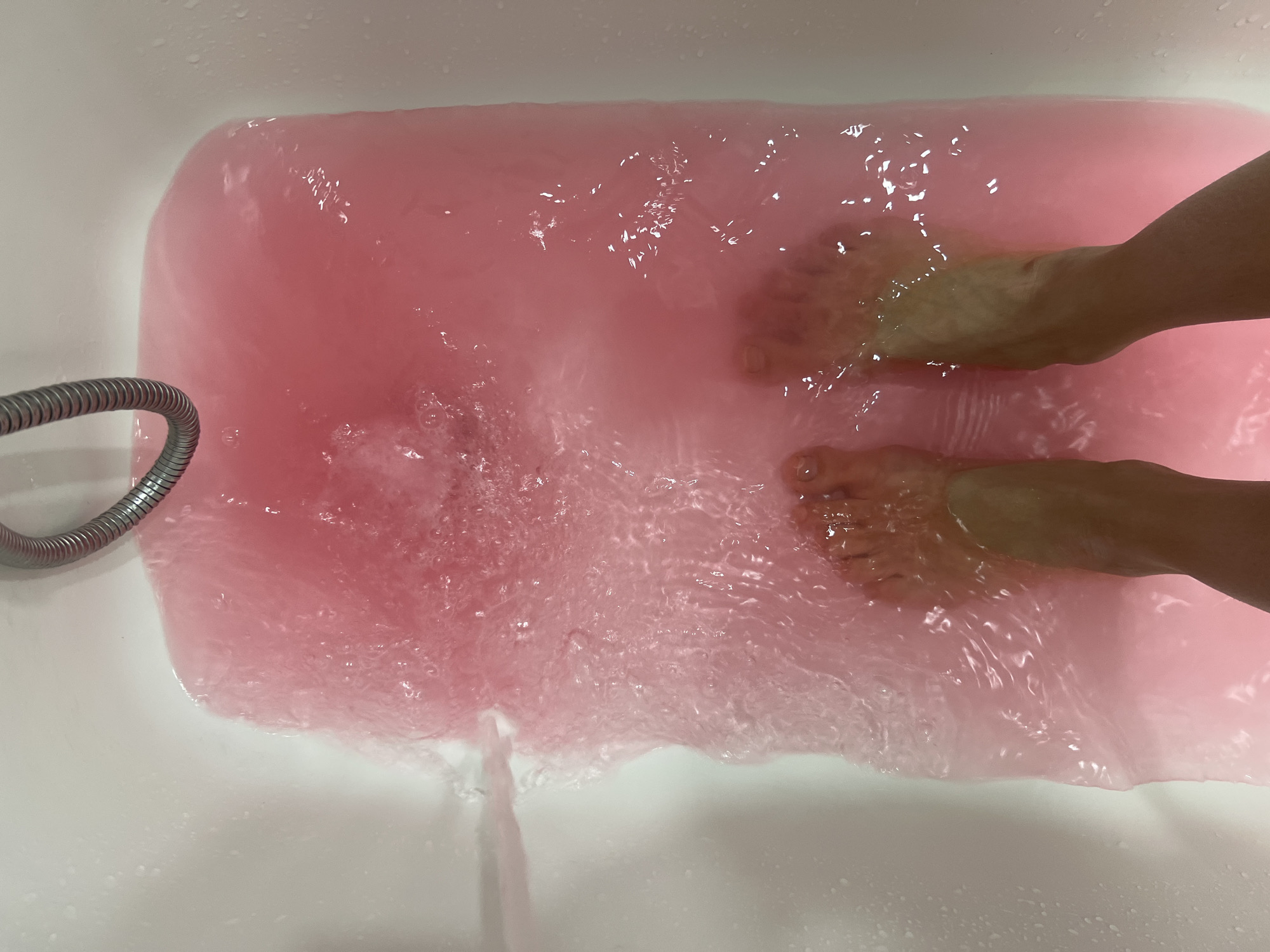 Person takes bath in pink water in Krasnoyarsk