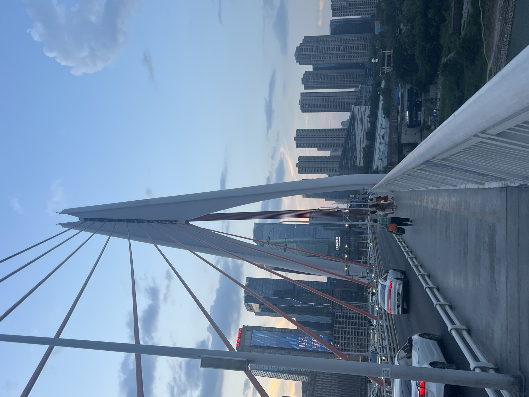 Chongqing's Yuzhong District at dusk, bridges to waterfront
