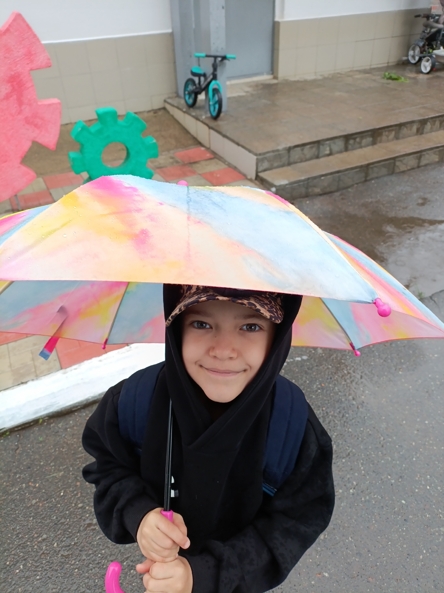 Rainy morning documented in Chaikovsky with polka-dot umbrella
