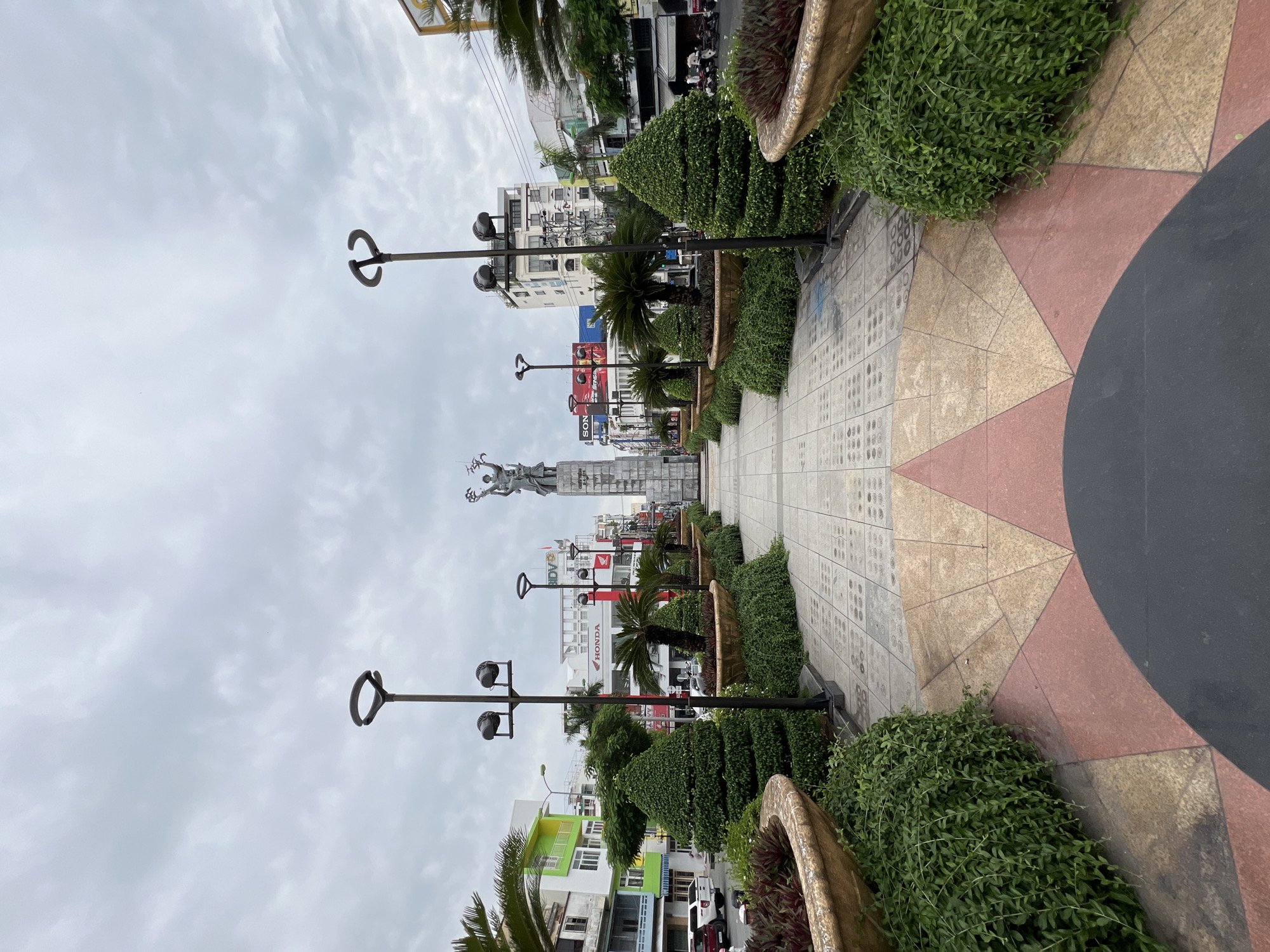 Everyday street life around Nha Trang's central plaza and monument