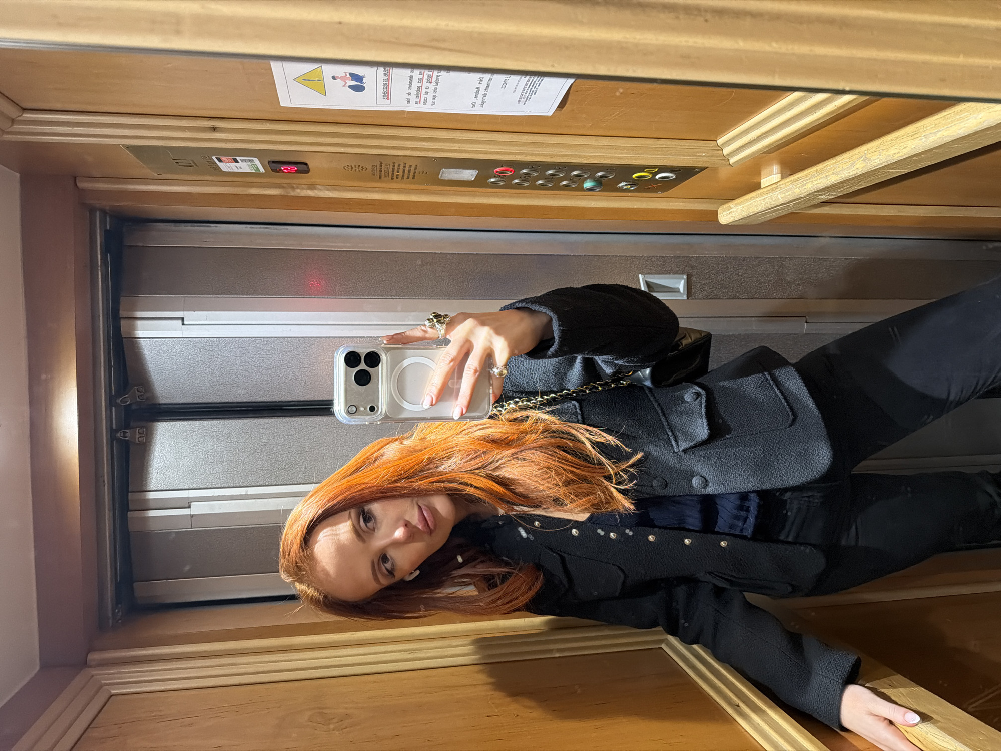 Woman takes elevator selfie in Paris