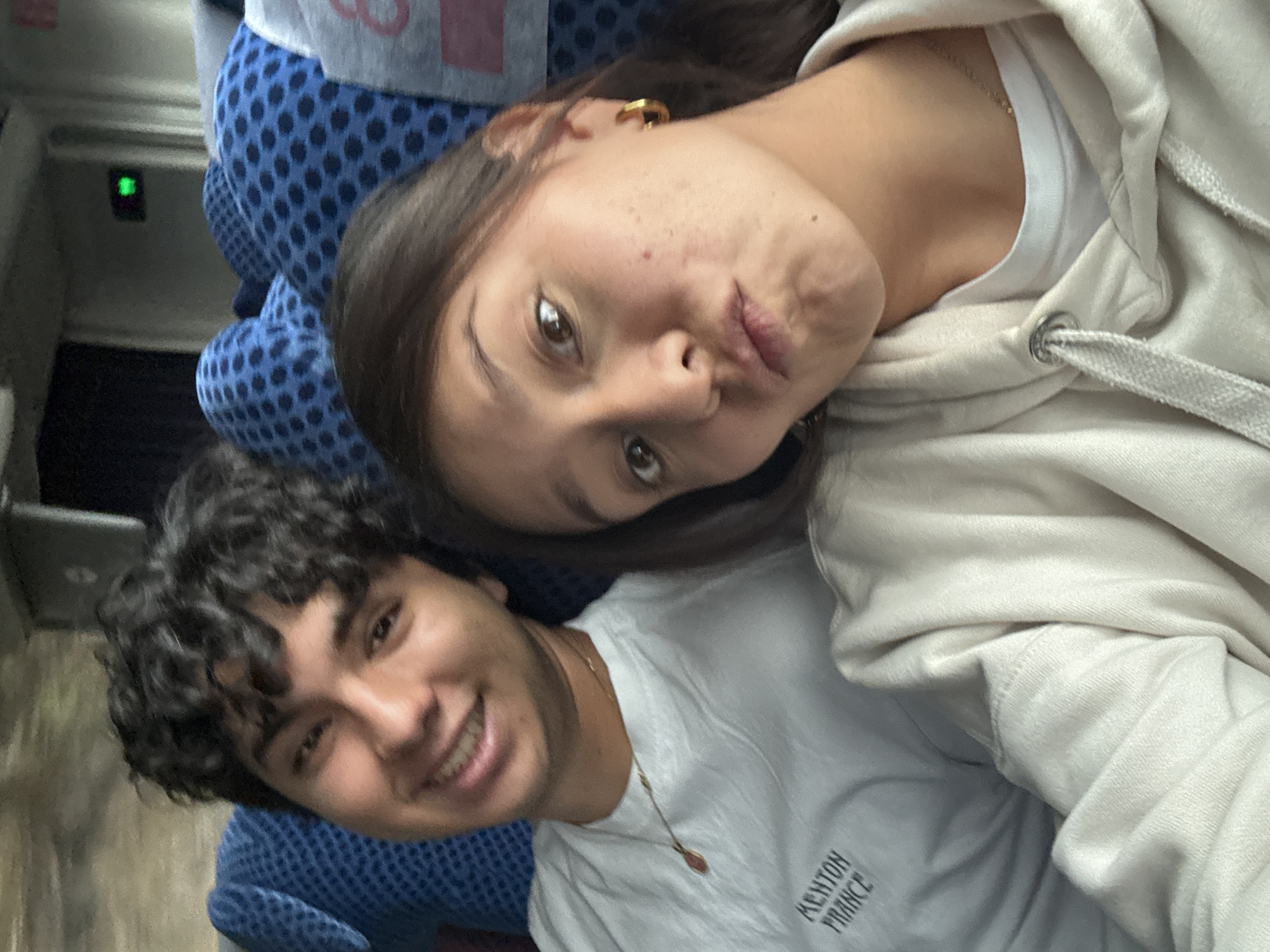 Couple takes playful selfie on public transport in Oaxaca