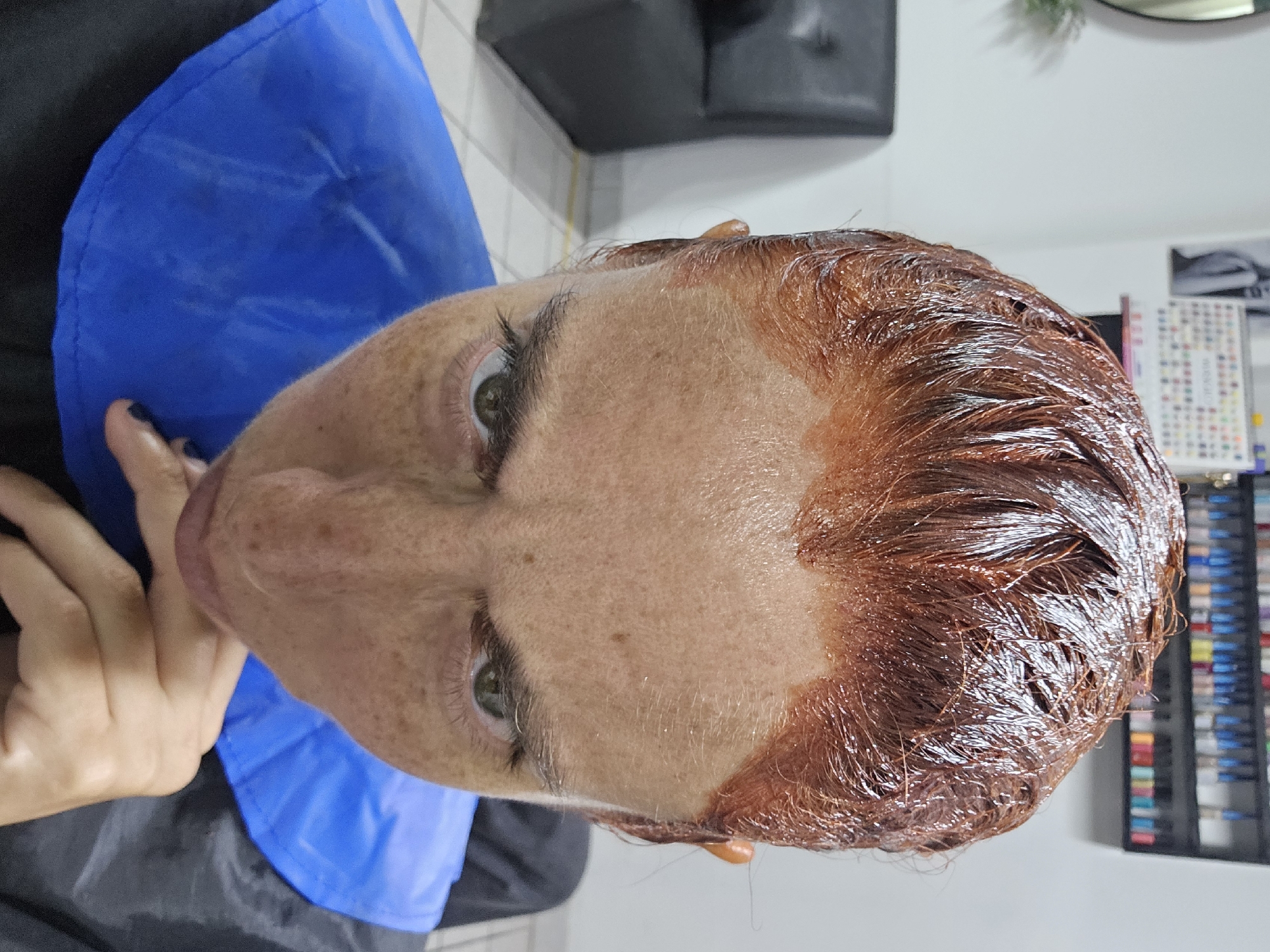 Woman gets hair dyed auburn, manicure at Peru salon