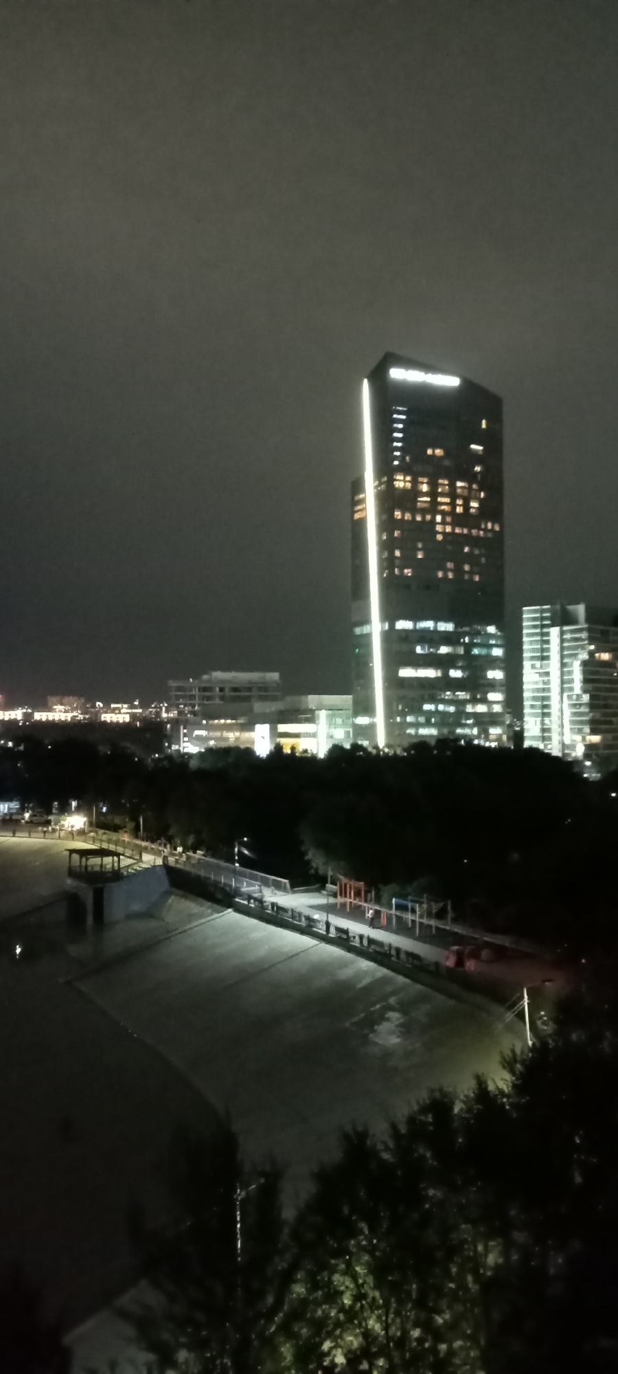 Almaty after dark: skyline, ski jumps, and waterfront lights