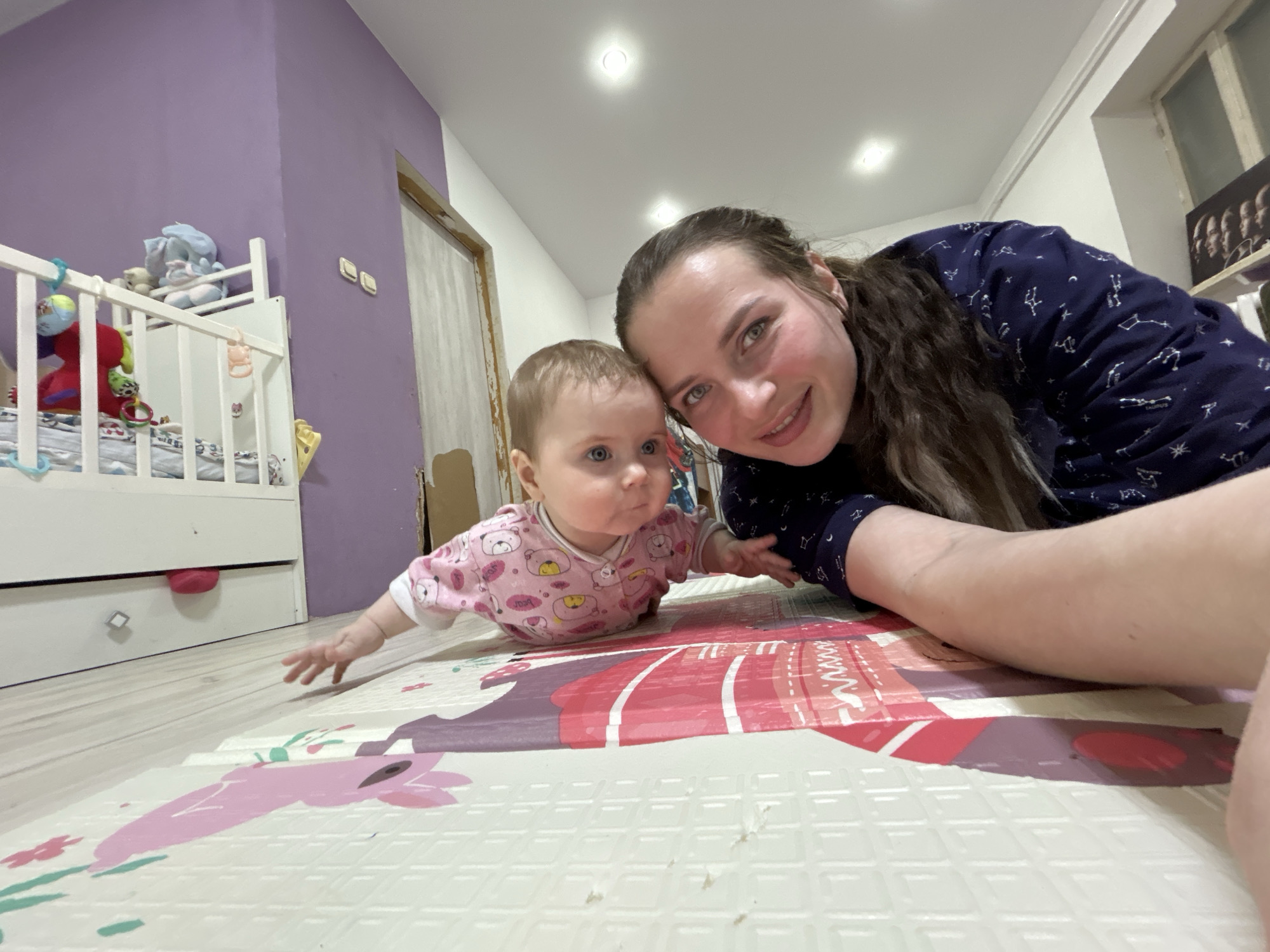 Child plays with building blocks on floor mat in Russia
