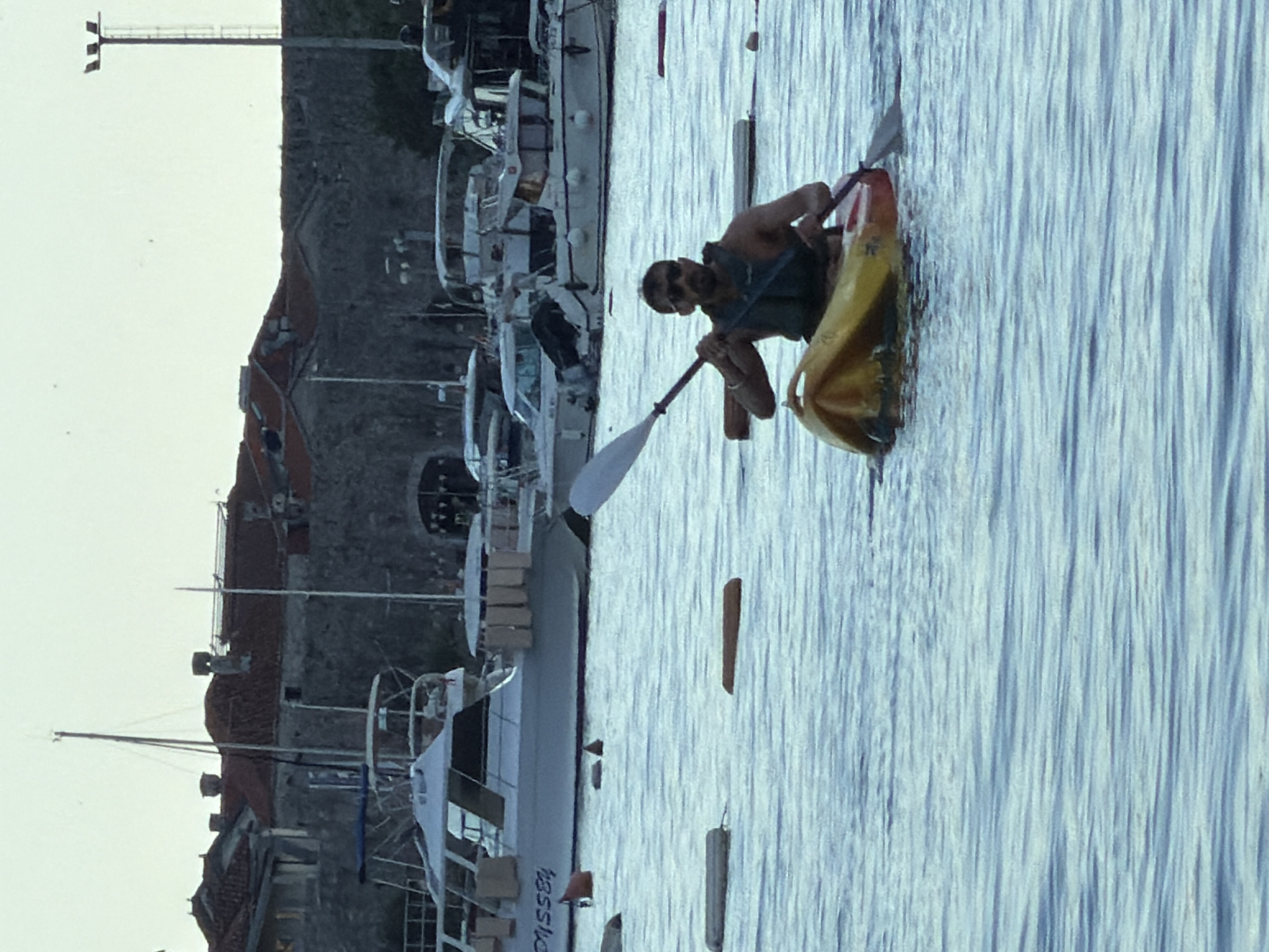 Late afternoon recreational activities observed across Budva waterfront and streets