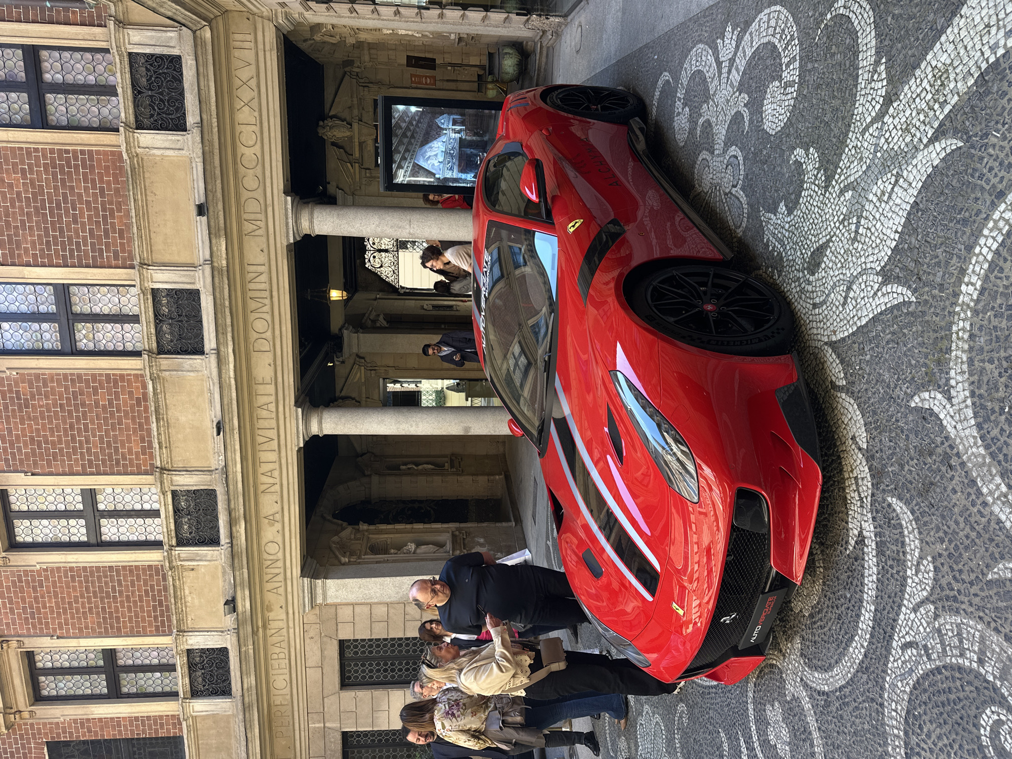 Red Ferrari spotted at historic Milan building