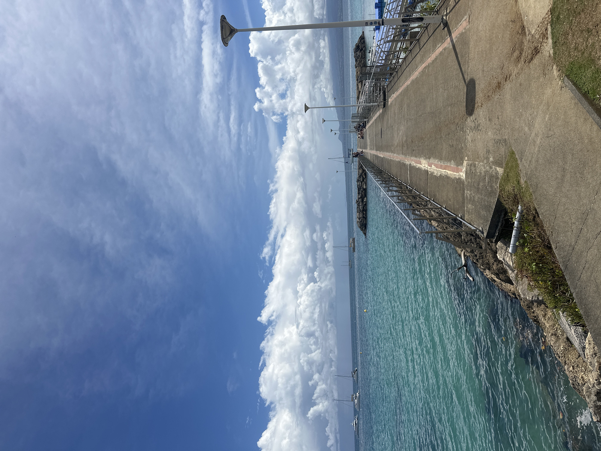 Coastal scene with sailboats captured in Le Gosier, France