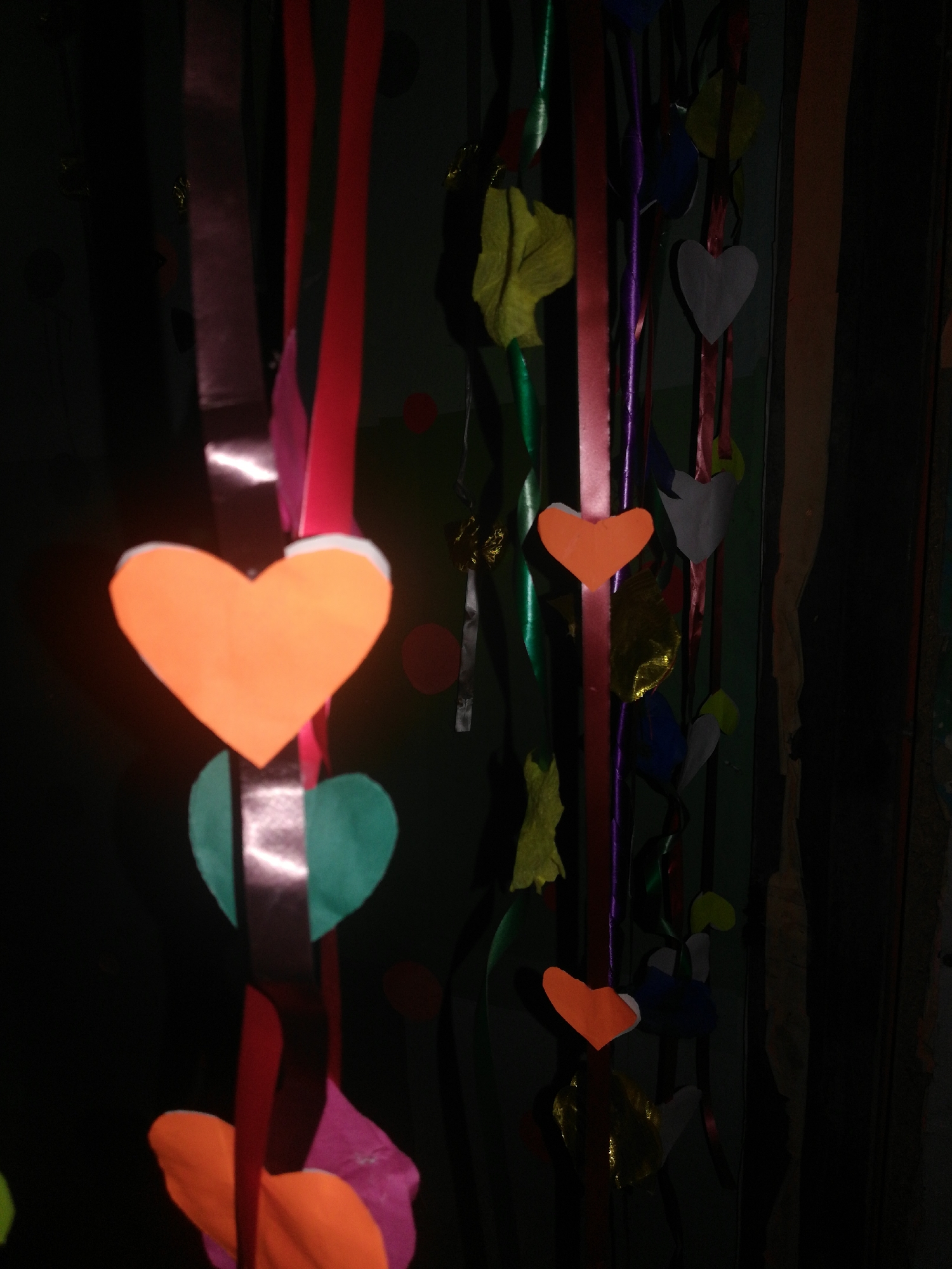 Colorful ribbon and heart decorations observed at unknown location