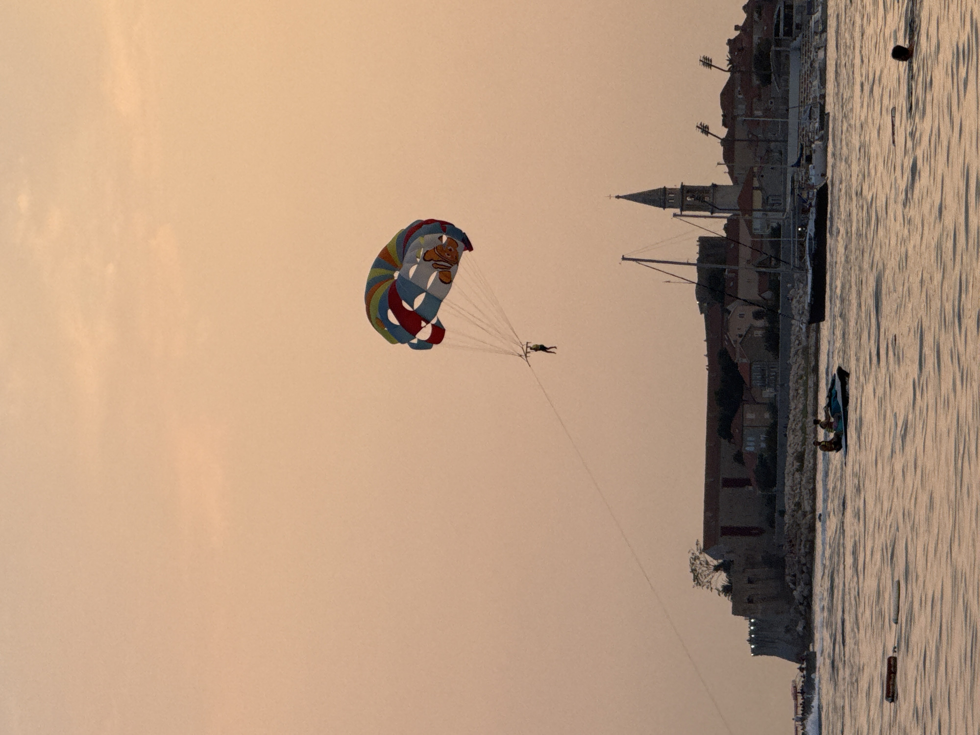 Parasailing and jet skiing off Budva at sunset