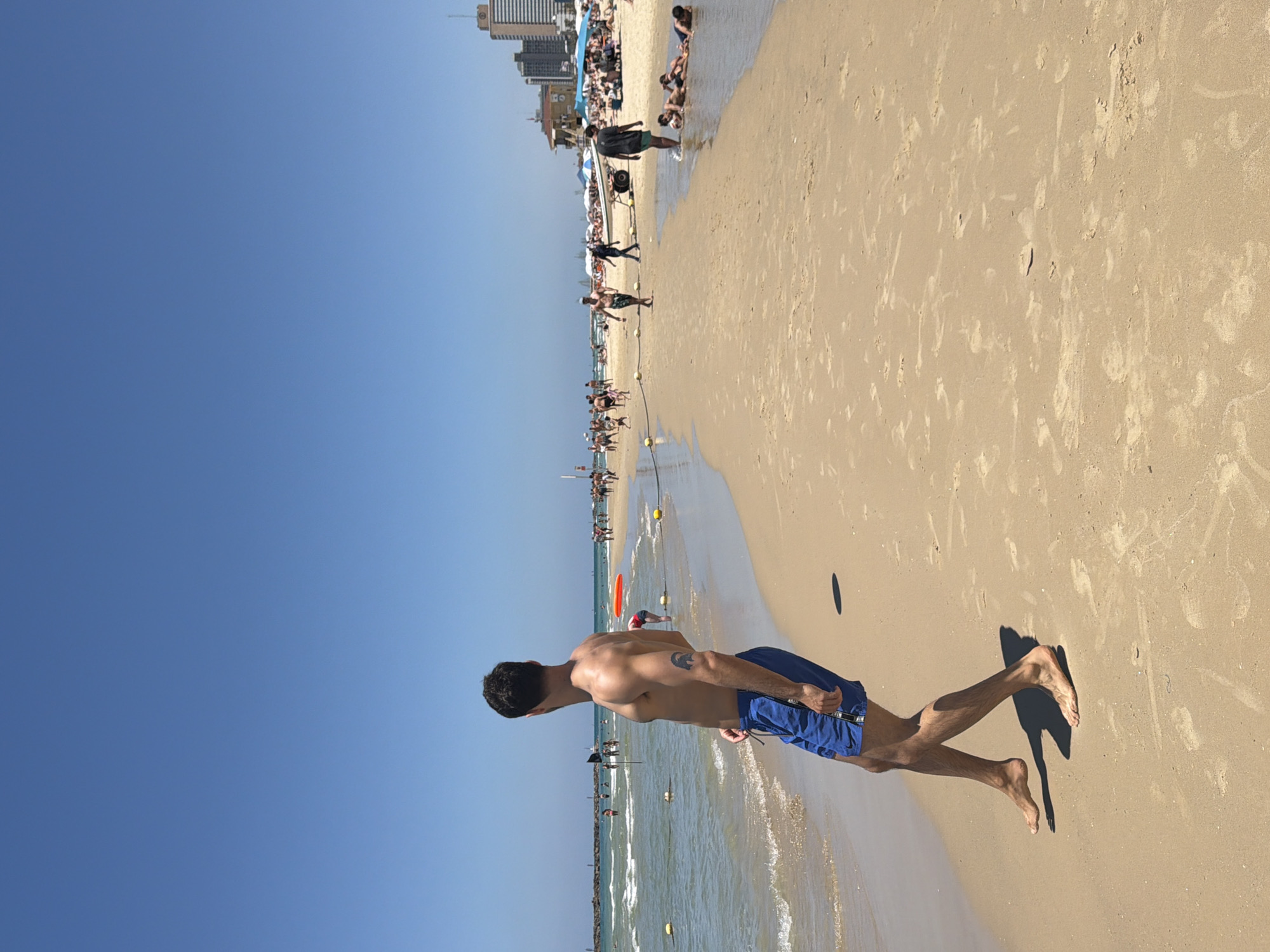 Tel Aviv beachgoers enjoy soccer under sunny skies