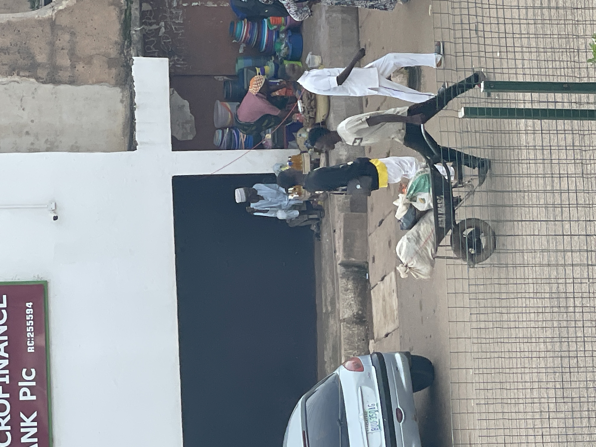 Midday street and market activity in a busy urban African setting