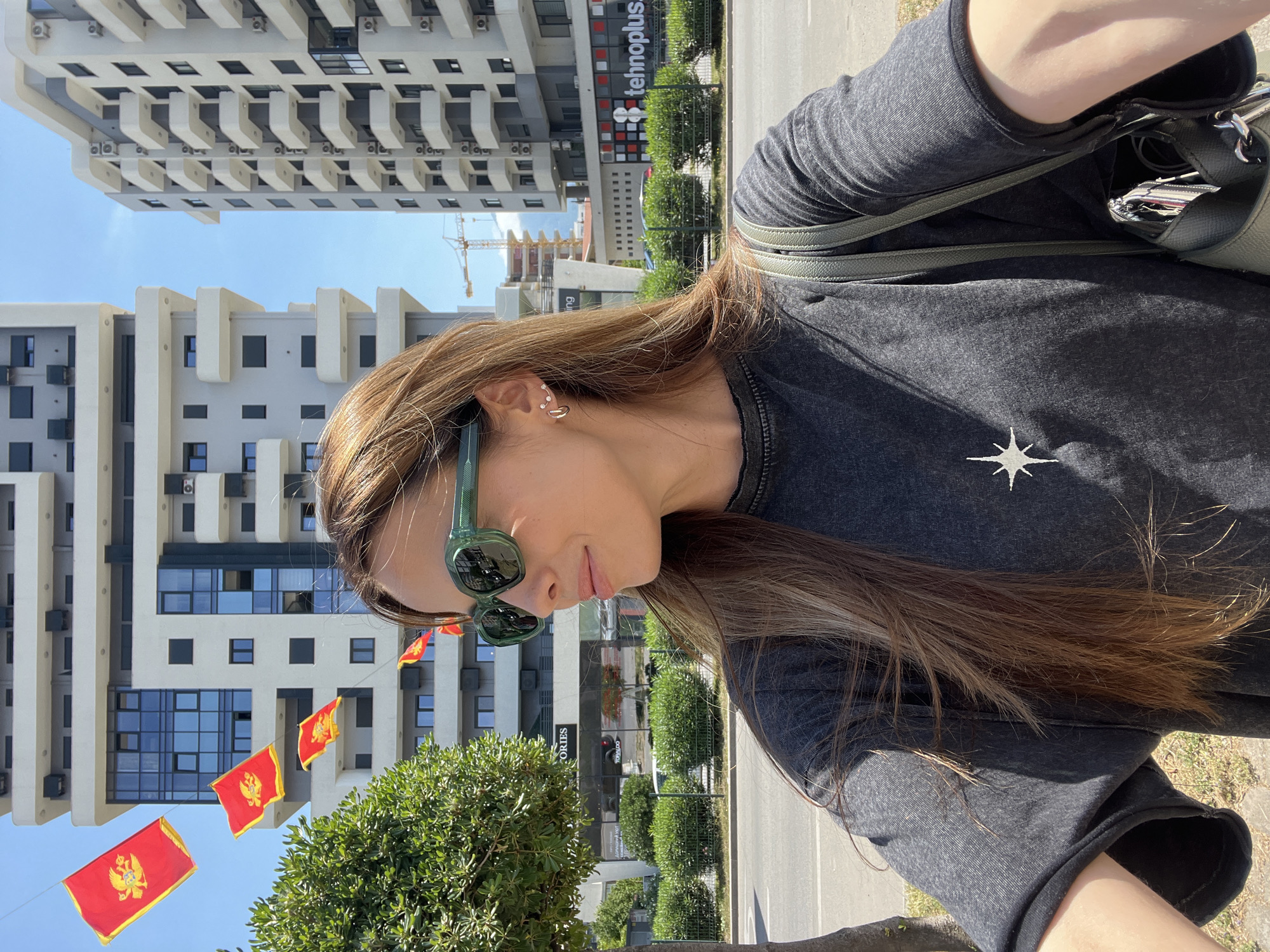 Woman takes selfie outdoors in Bar, Montenegro