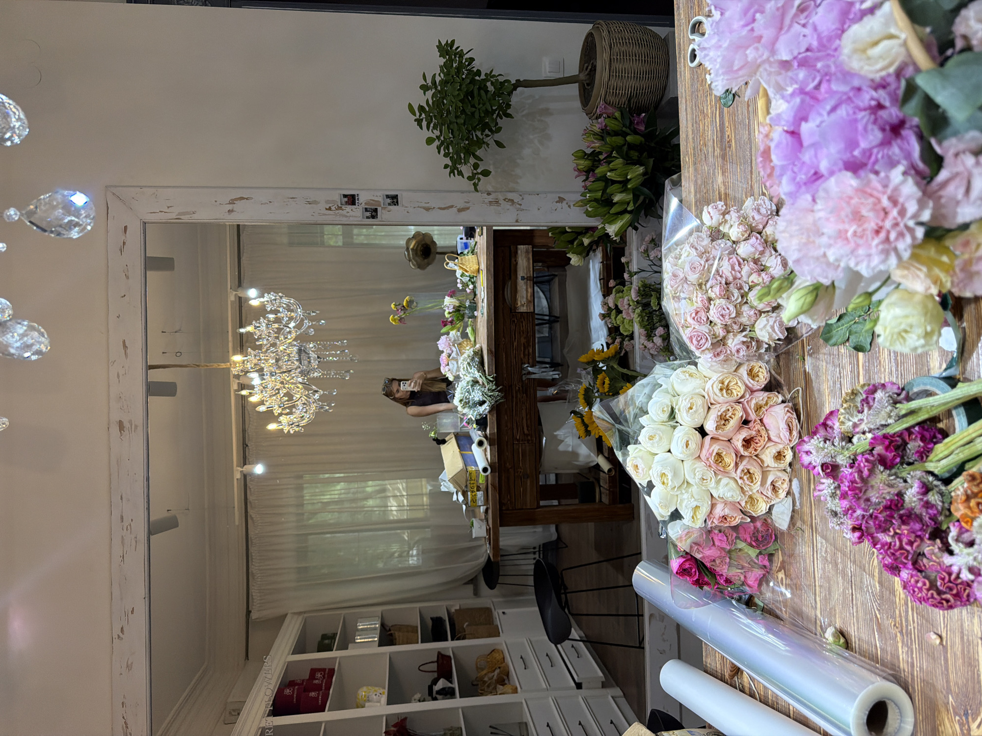 Inside a Bishkek flower shop during a busy morning of arranging