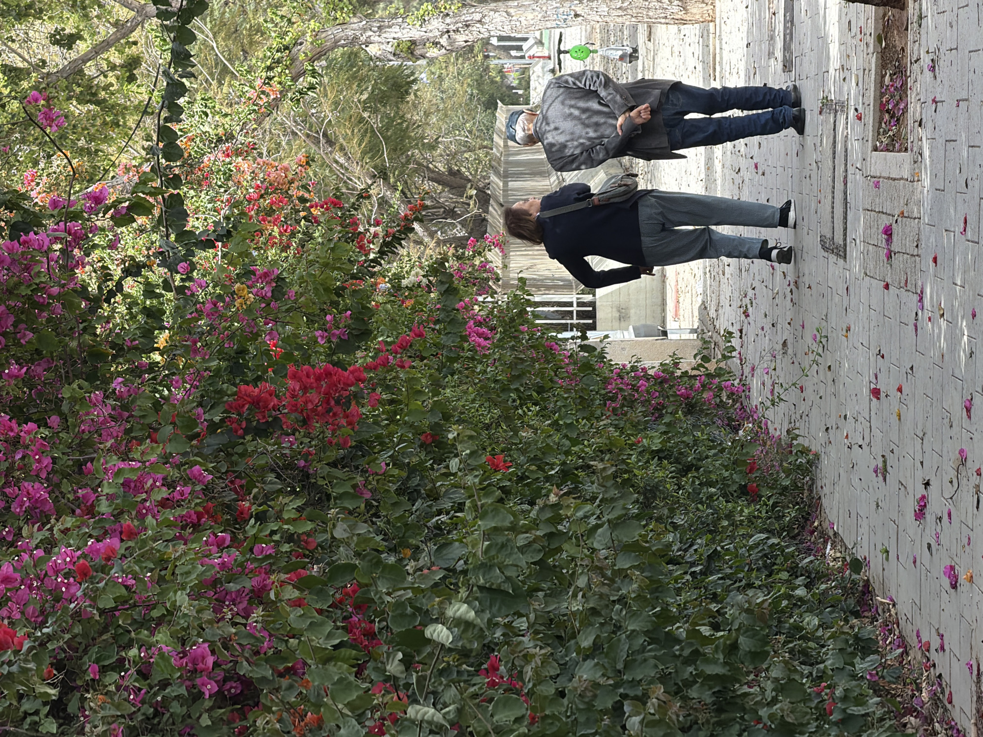 Pedestrians walk on Tel Aviv sidewalk Saturday morning