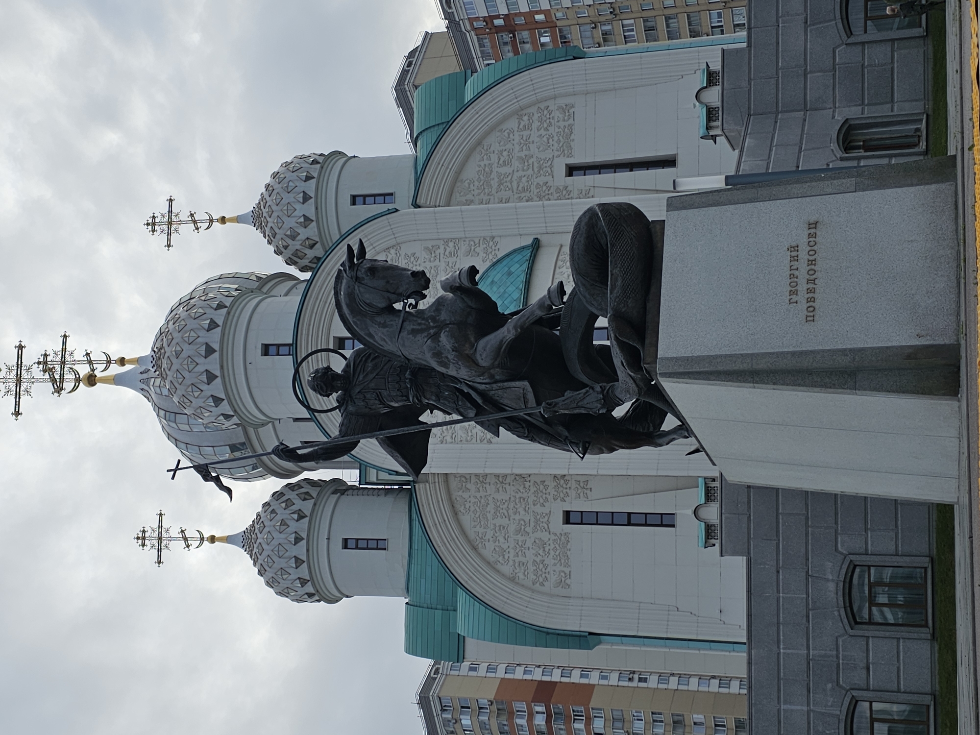 Church, reservoir promenade, and a weightlifting meet in Khimki