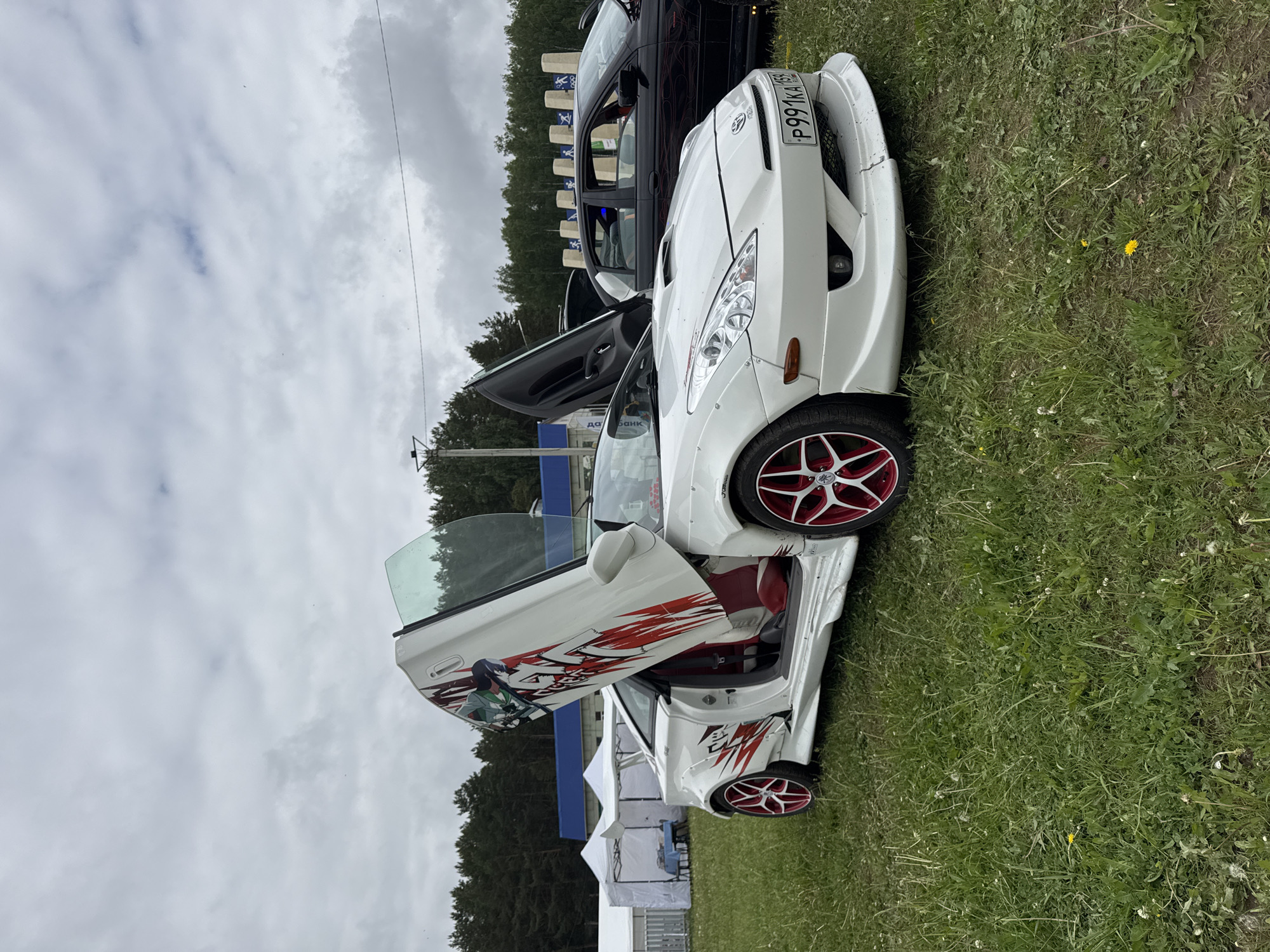 Car enthusiasts gather for automotive show in Chaikovsky, Russia