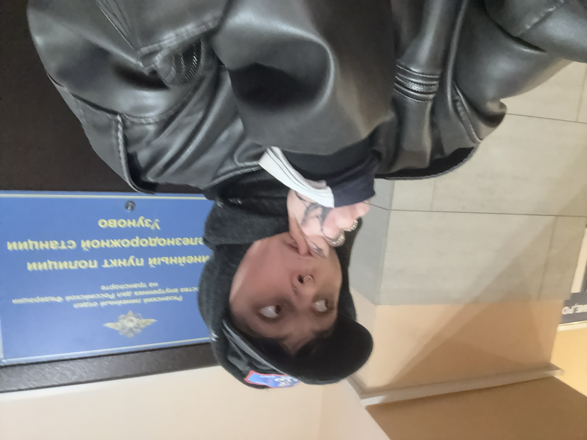 Person photographed in leather jacket at Uzunovo public building
