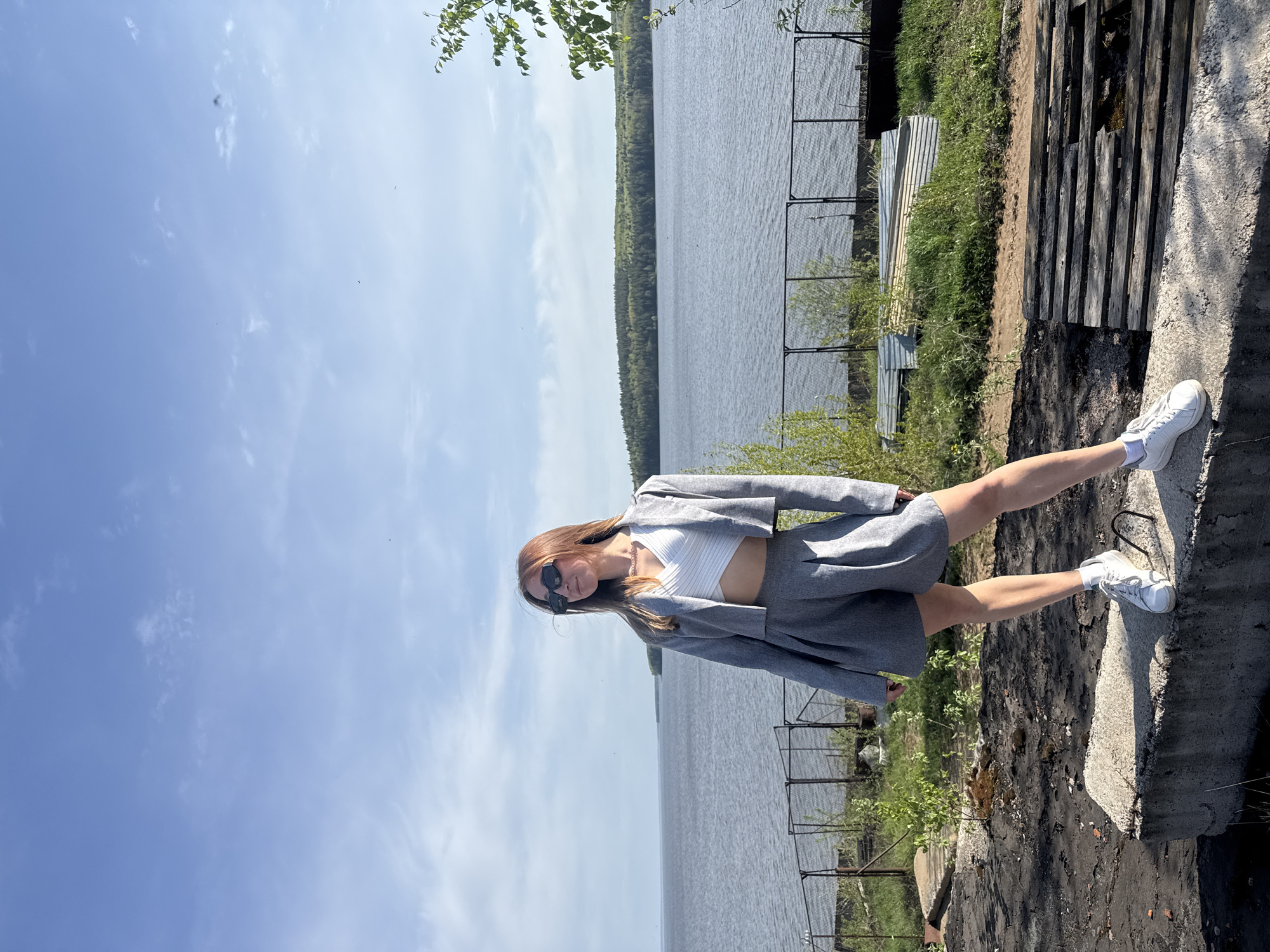 Woman poses for photos along Kama River in Chaikovsky