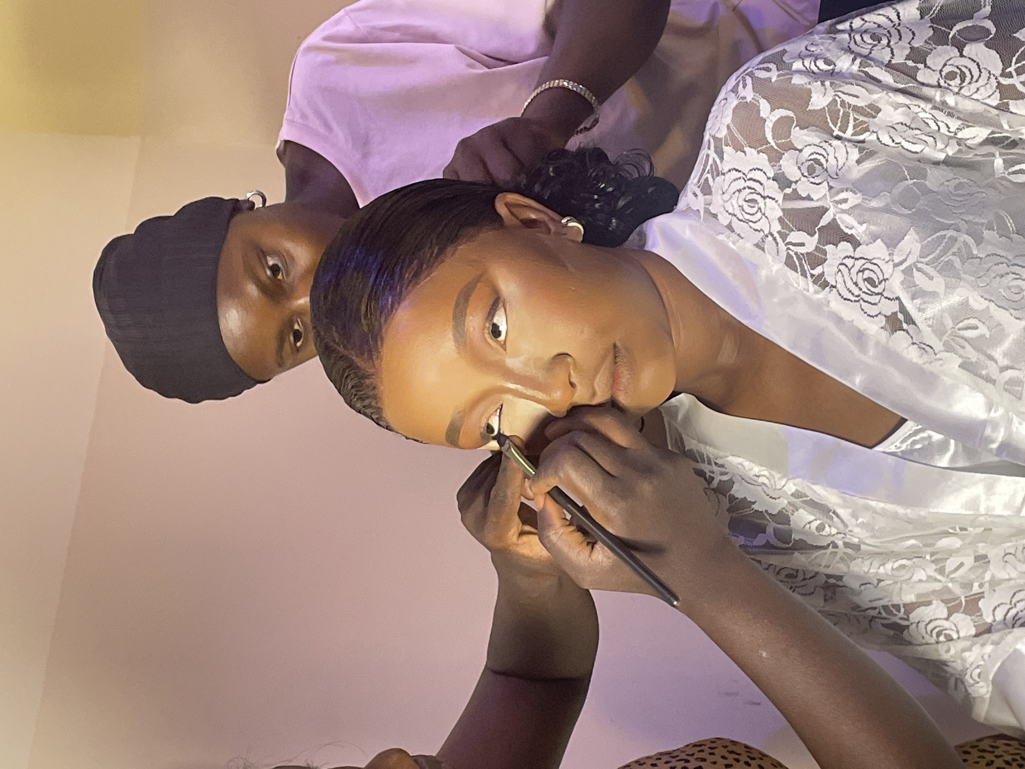 Woman receives makeup, white bouquet prepared in Jos
