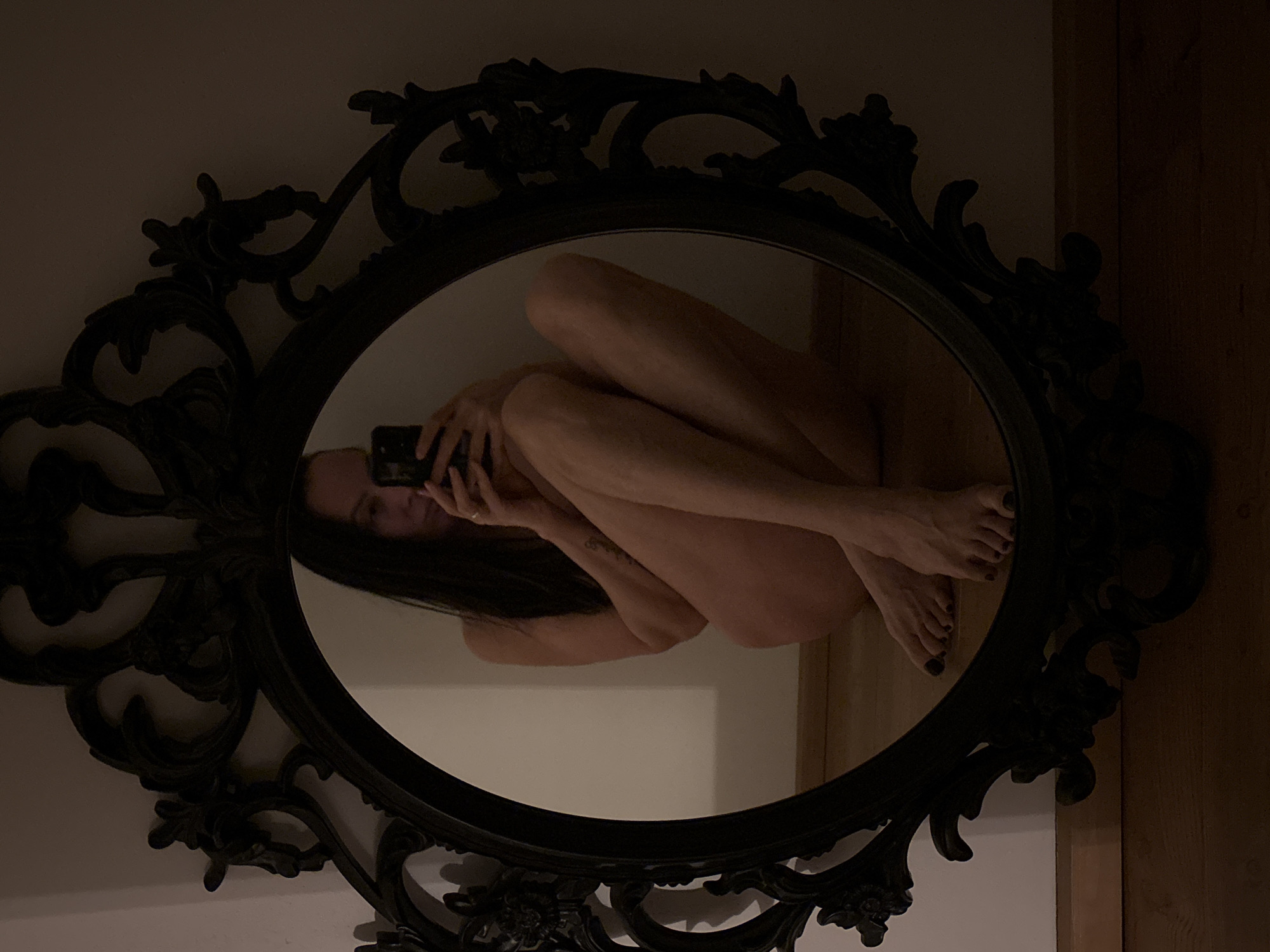 Individual observed in ornate mirror in Chaikovsky, Russia