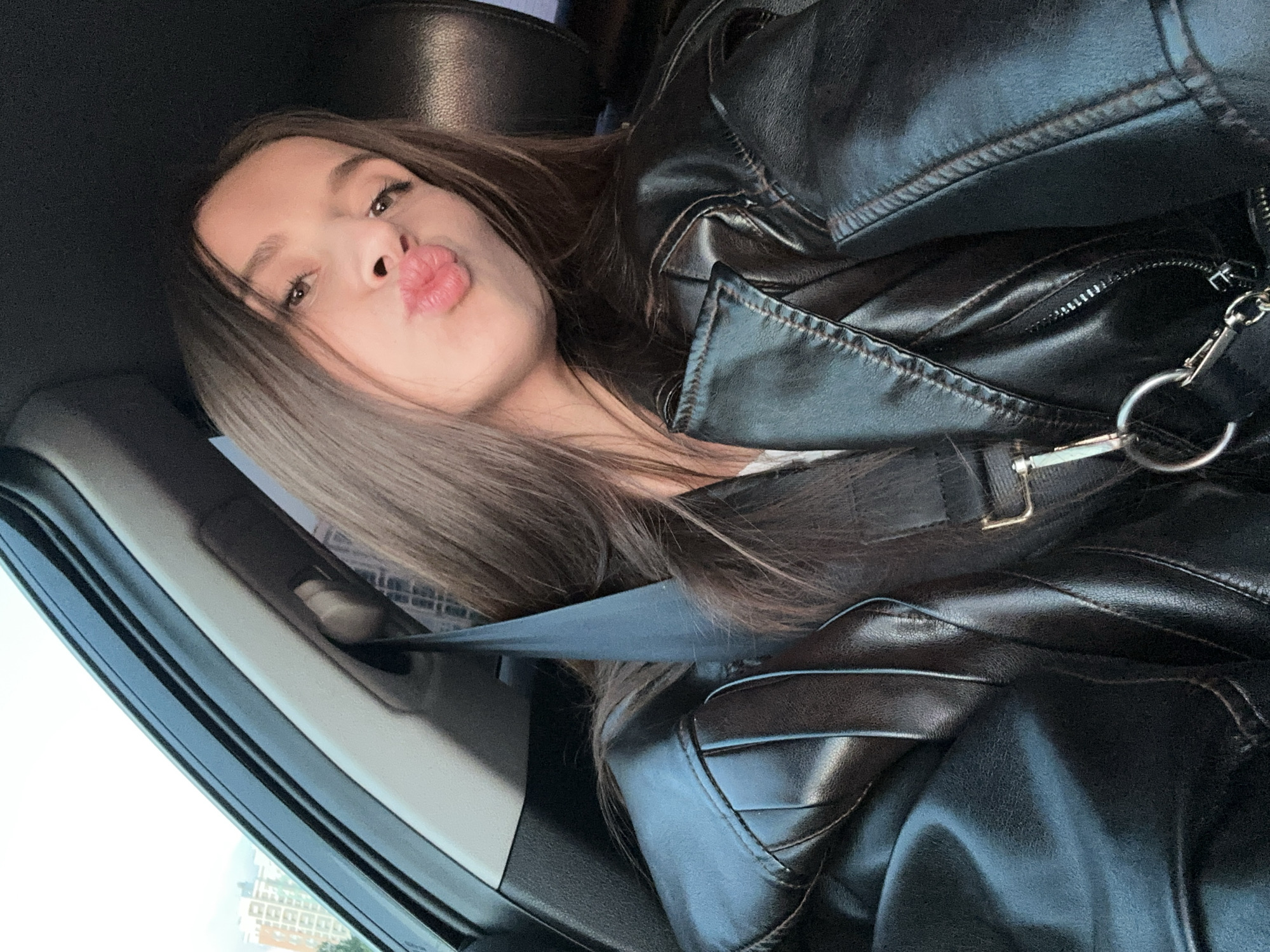 Woman takes selfie in car in Yekaterinburg