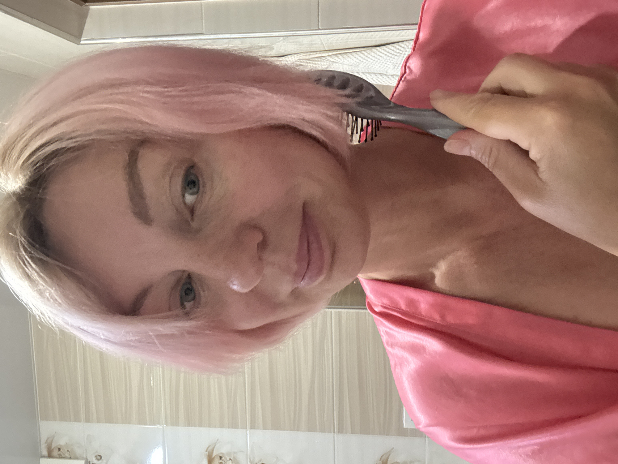 Lazy Sochi morning in a pink robe and cat-ear mask