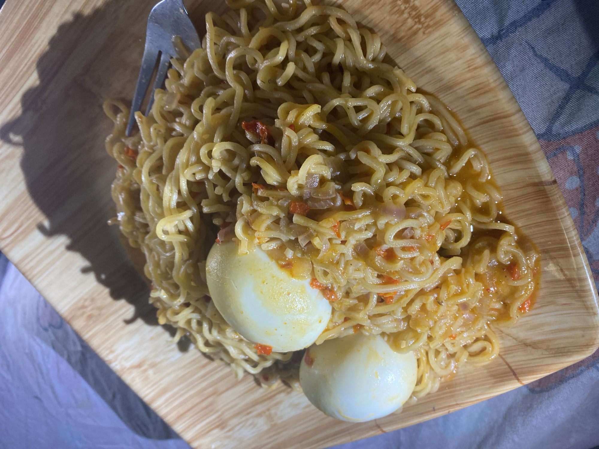 Instant noodles and eggs for a late-night meal in Abuja
