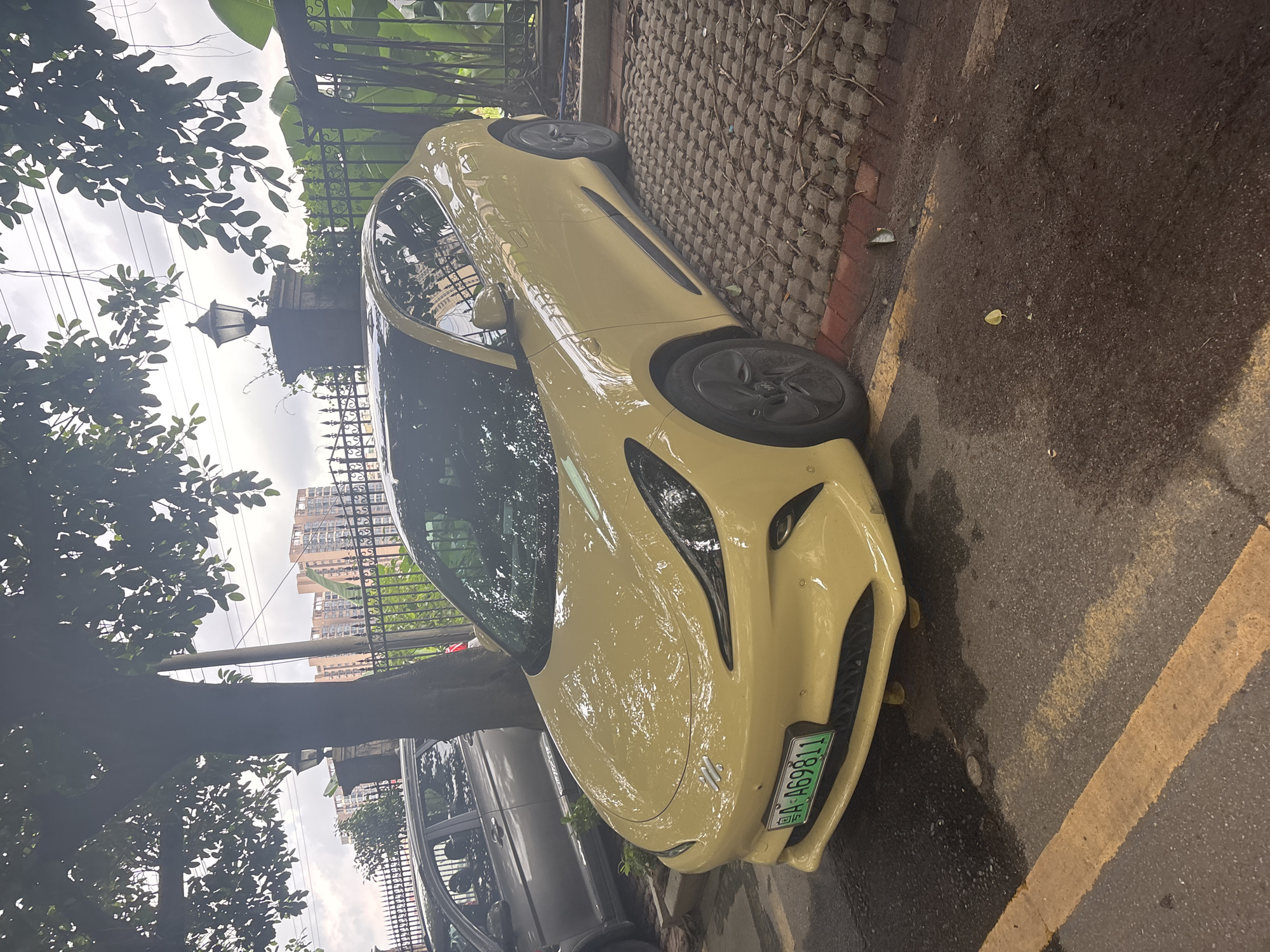 Mixed vehicles parked on brick pavers in Nanhai District