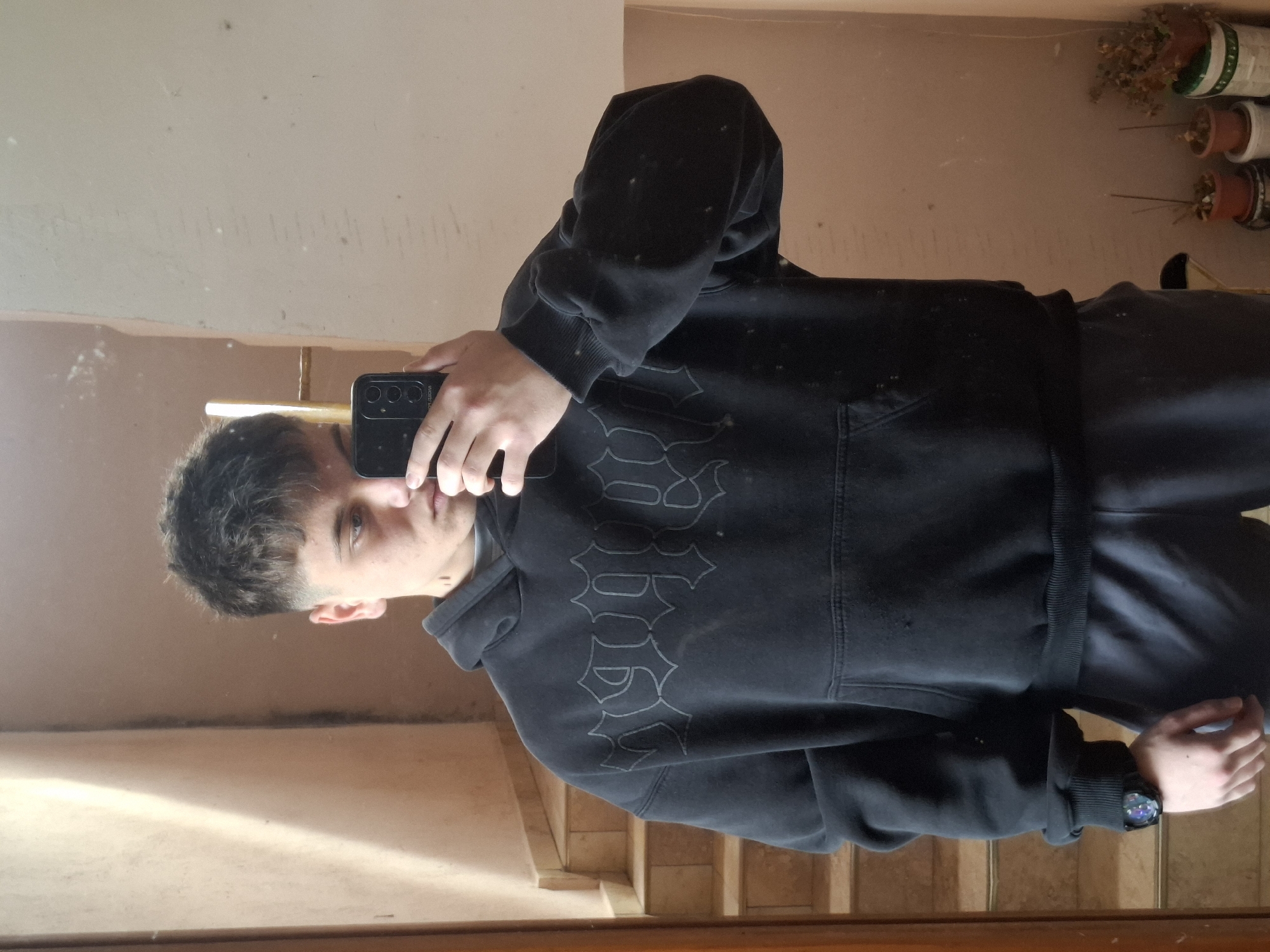 Young man takes mirror selfie in Veliki Preslav building