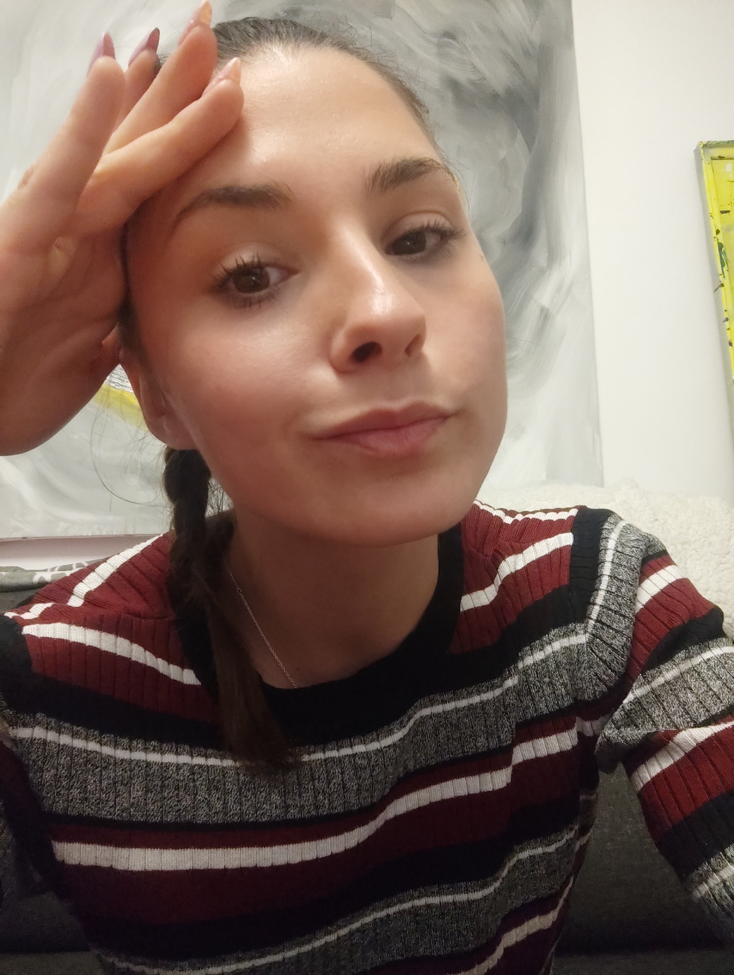 Woman takes selfie in striped sweater in Razgrad, Bulgaria