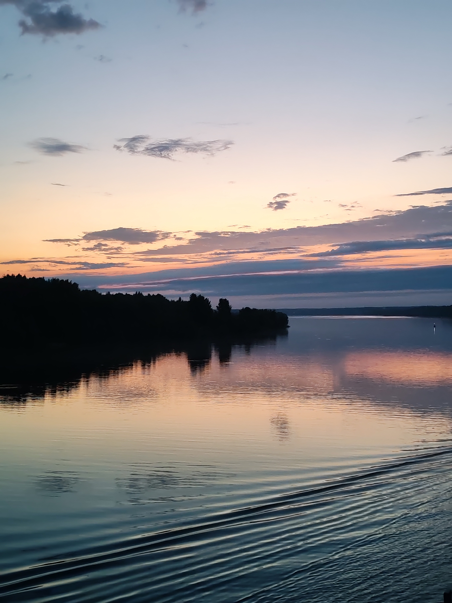 Colorful sunset observed over water in Baskachi, Russia