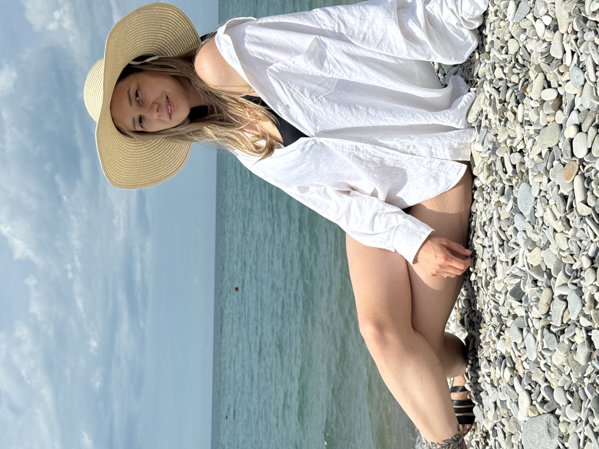 Woman relaxes on Russian beach in morning hours
