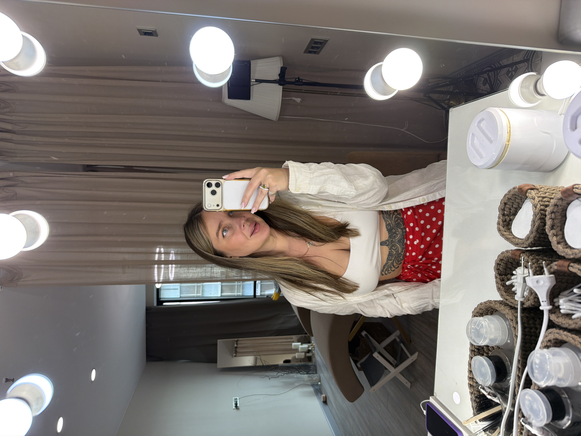 Woman takes selfie in Moscow makeup room