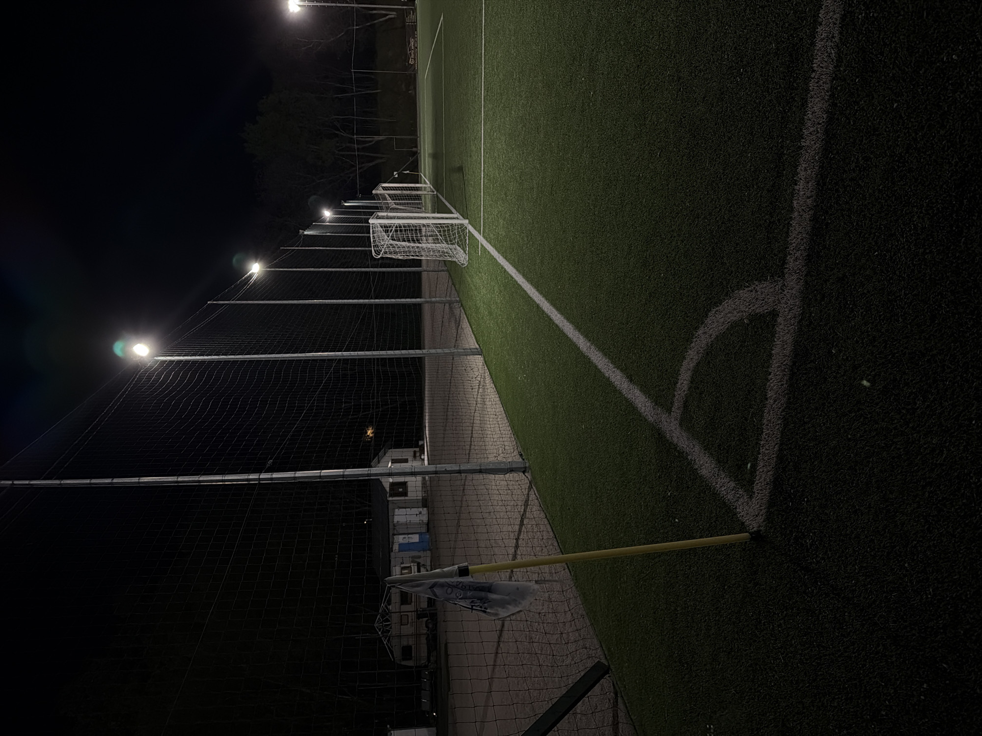 Empty soccer field illuminated at night in Pleven, Bulgaria
