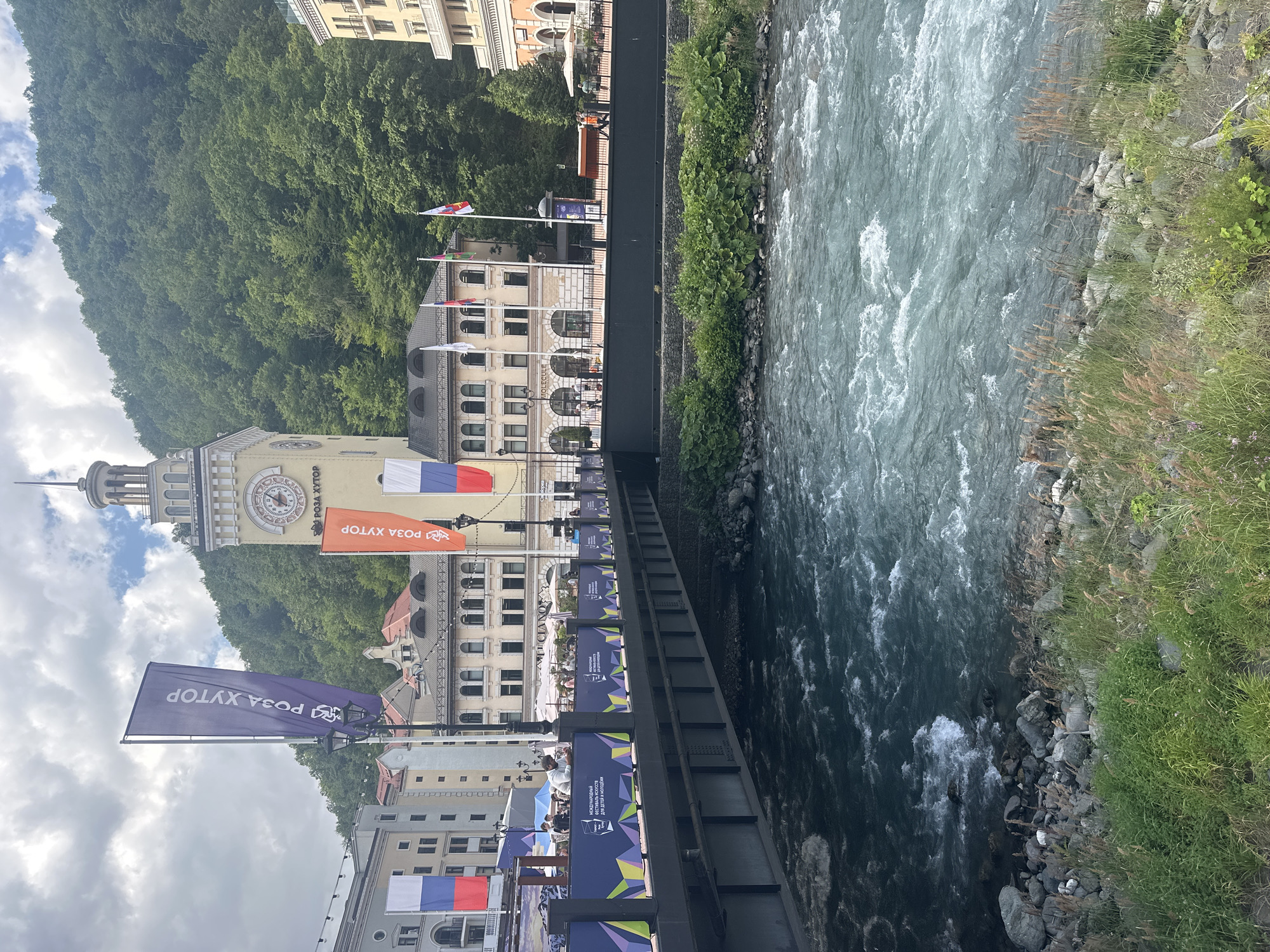 Rosa Khutor's summer market scene along the Mzymta River promenade
