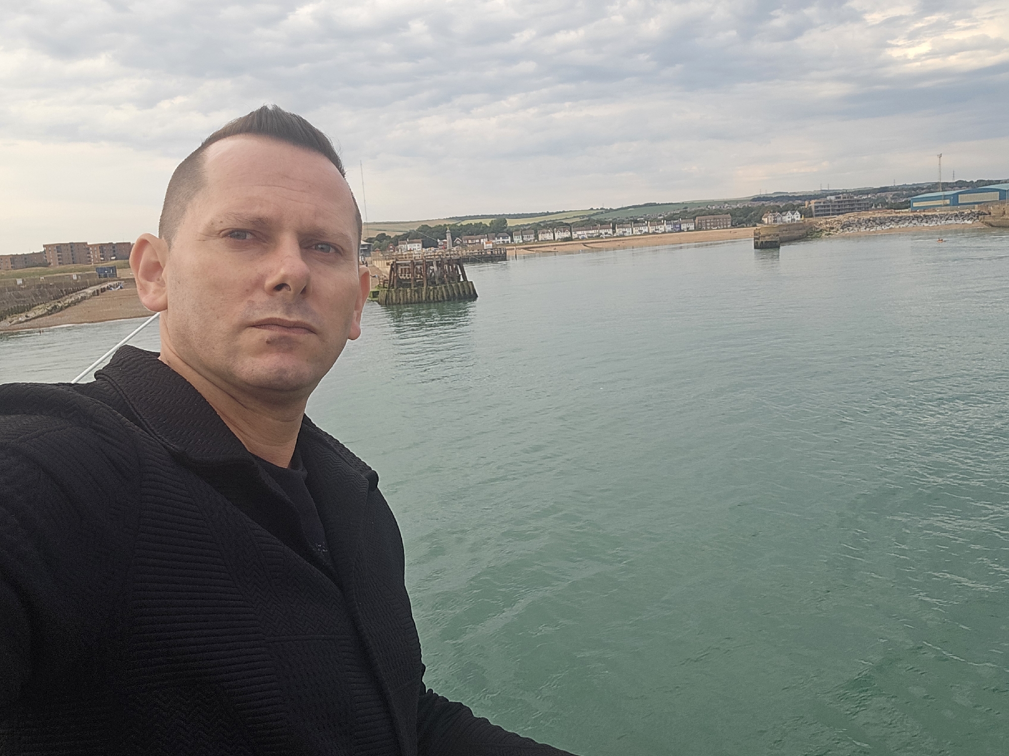 Selfies and fishing on an Adur pier, cloudy afternoon