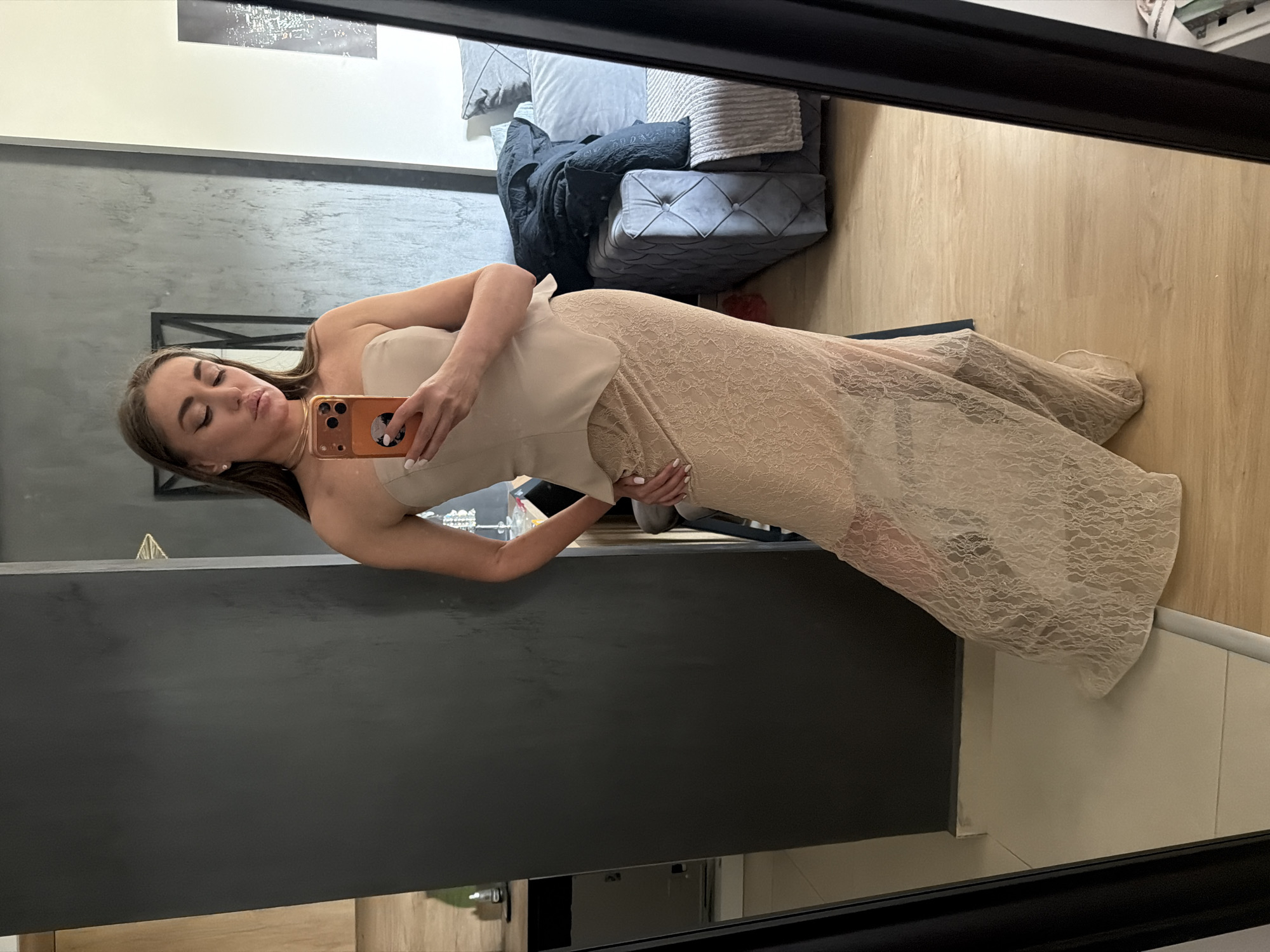Woman takes mirror selfie in modern setting, Bar Montenegro