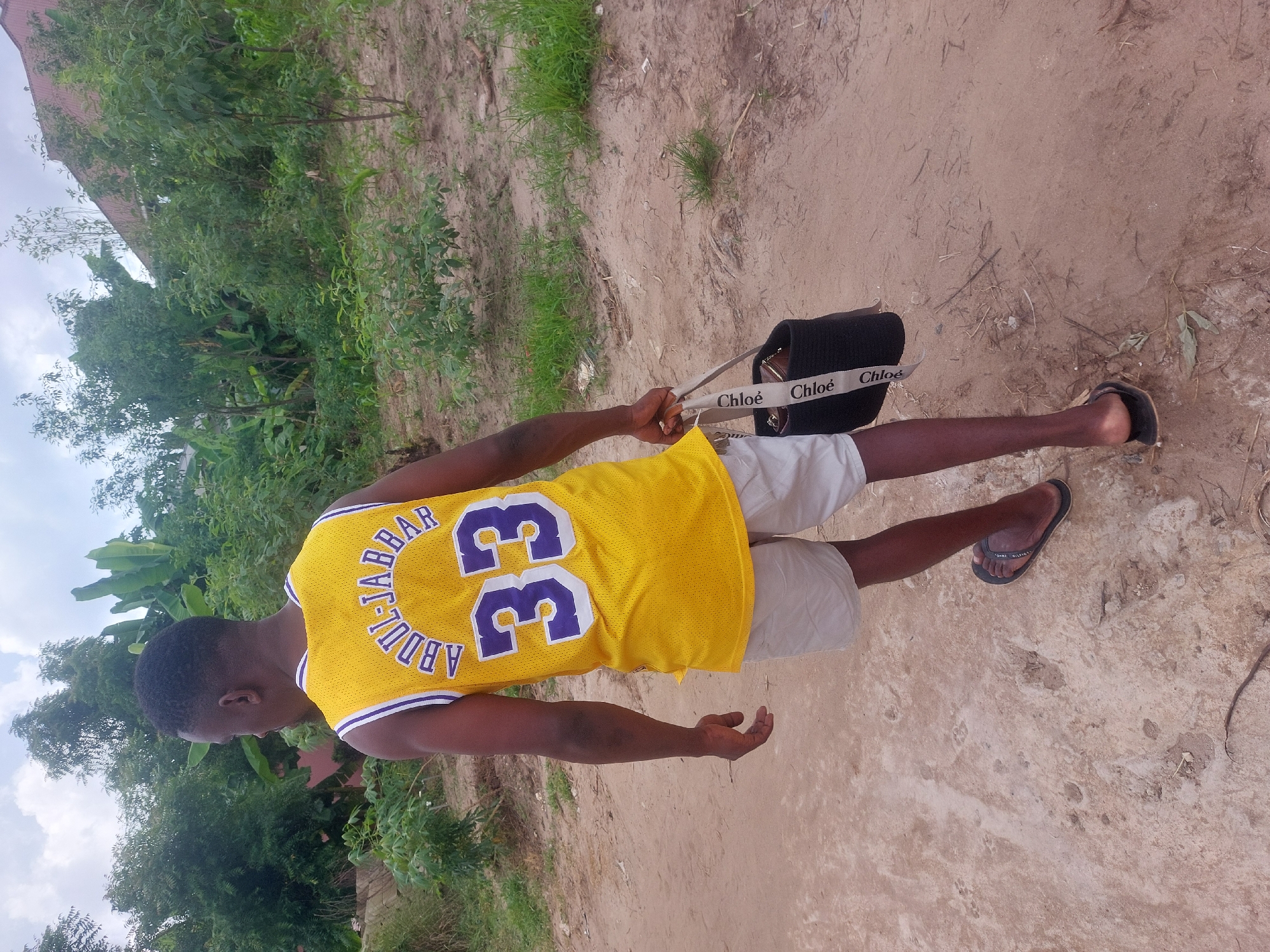 Man in Lakers jersey spotted with designer purse in Dar es-Salaam